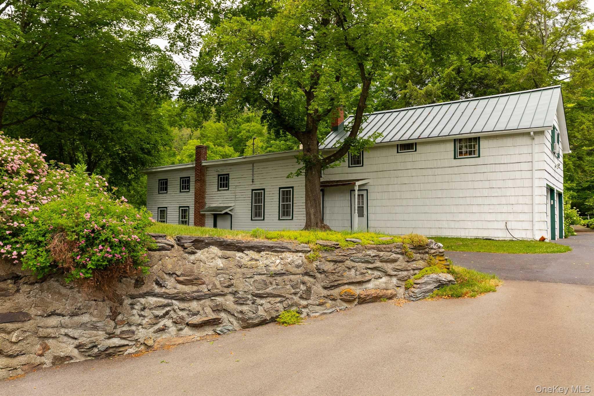 1598 Jackson Corners Road Red Hook, NY 12571 - Photo 21 of 36 front view of a house with a patio