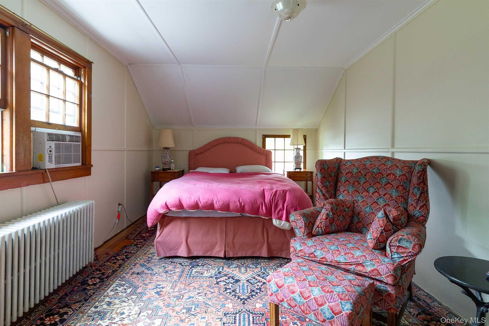 1598 Jackson Corners Road Red Hook, NY 12571 - Photo 25 of 36 a spacious bedroom with a bed and wooden floor