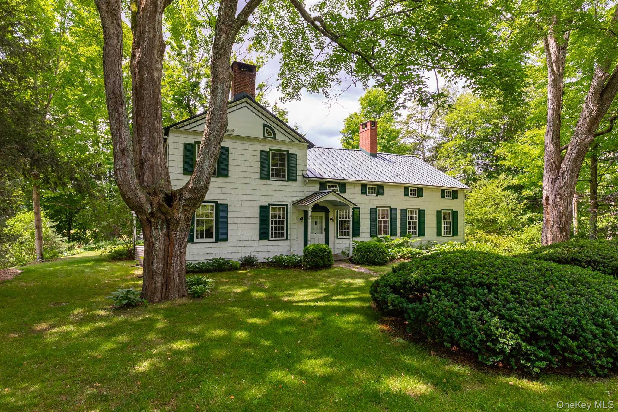 1598 Jackson Corners Road Red Hook, NY 12571 - Photo 3 of 36 a front view of a house with a yard