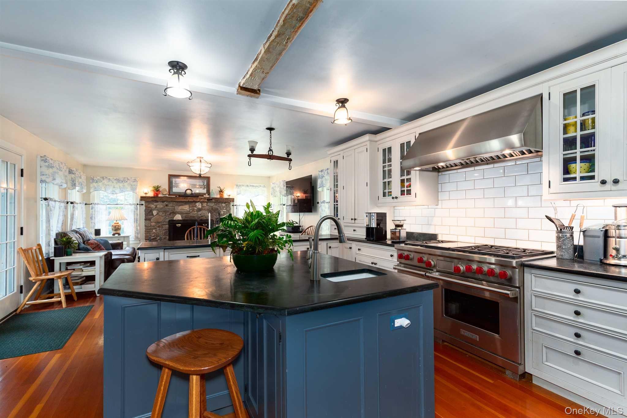 1598 Jackson Corners Road Red Hook, NY 12571 - Photo 5 of 36 a kitchen with stainless steel appliances granite countertop a stove a chimney a sink and cabinets
