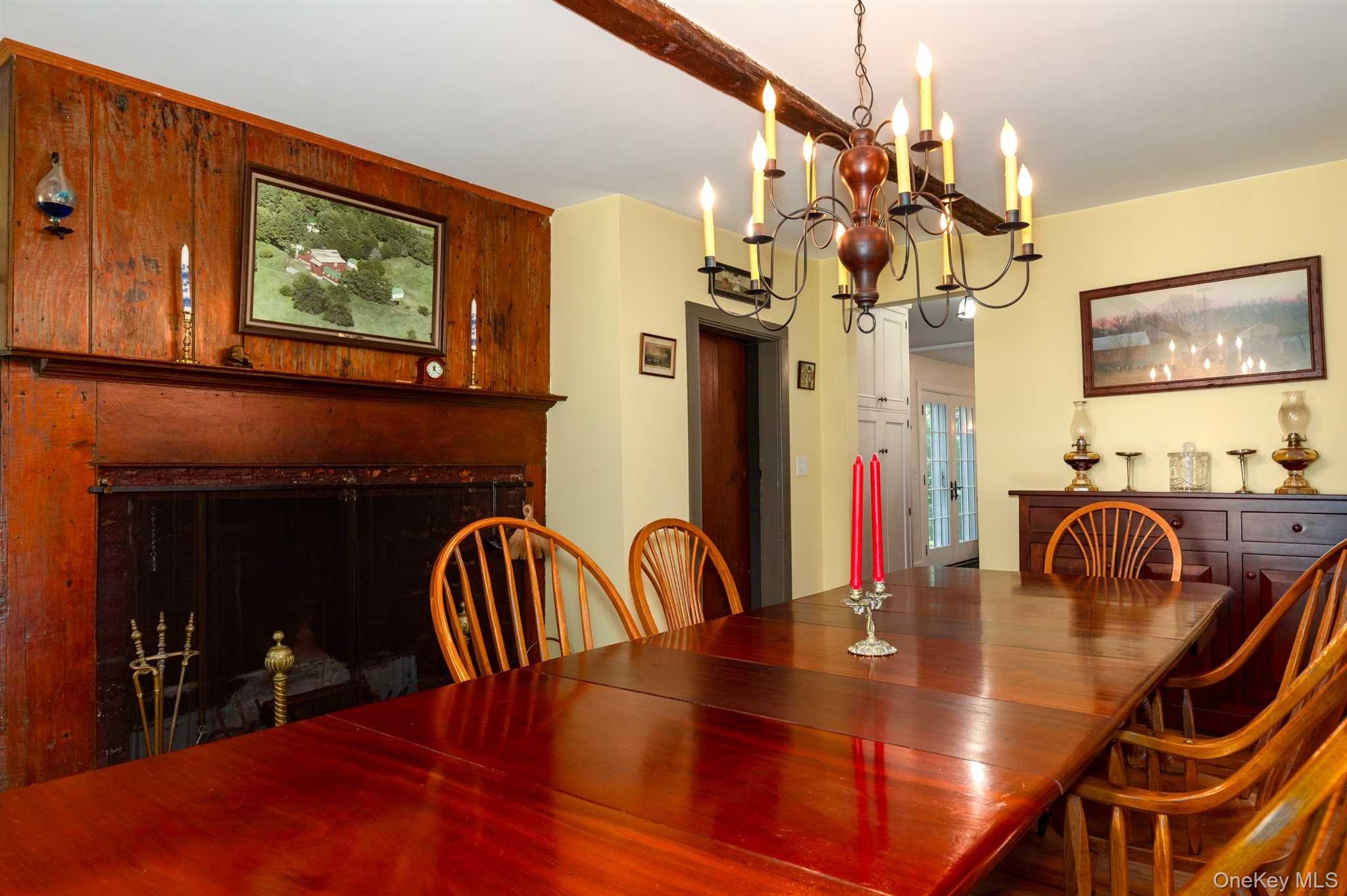1598 Jackson Corners Road Red Hook, NY 12571 - Photo 9 of 36 a view of a dining room with furniture and chandelier
