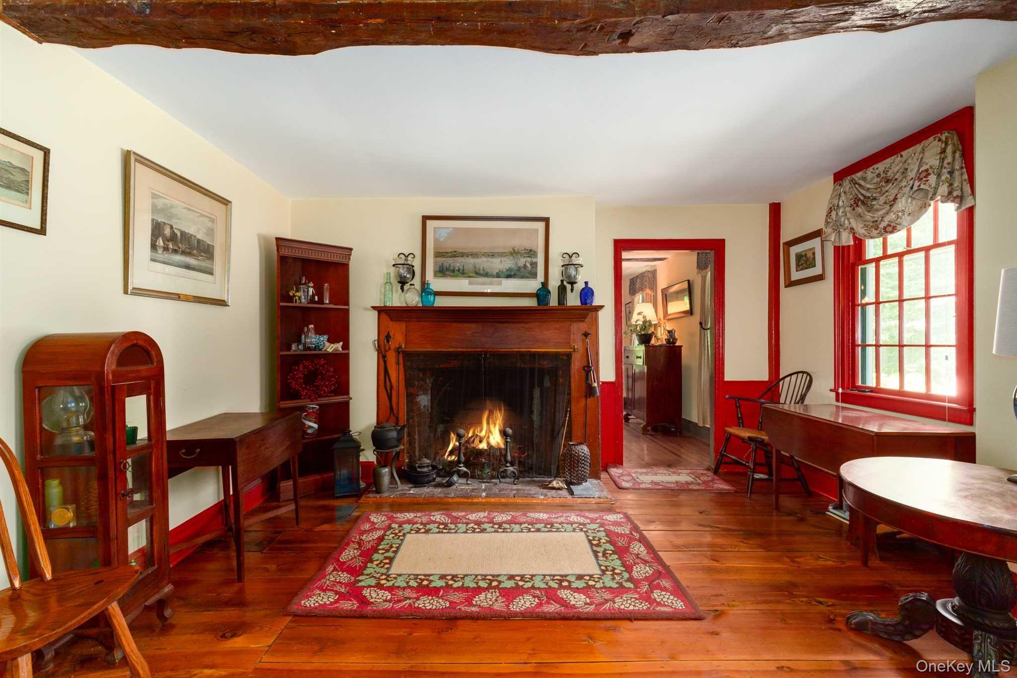 1598 Jackson Corners Road Red Hook, NY 12571 - Photo 10 of 36 a living room with furniture a rug and a fireplace