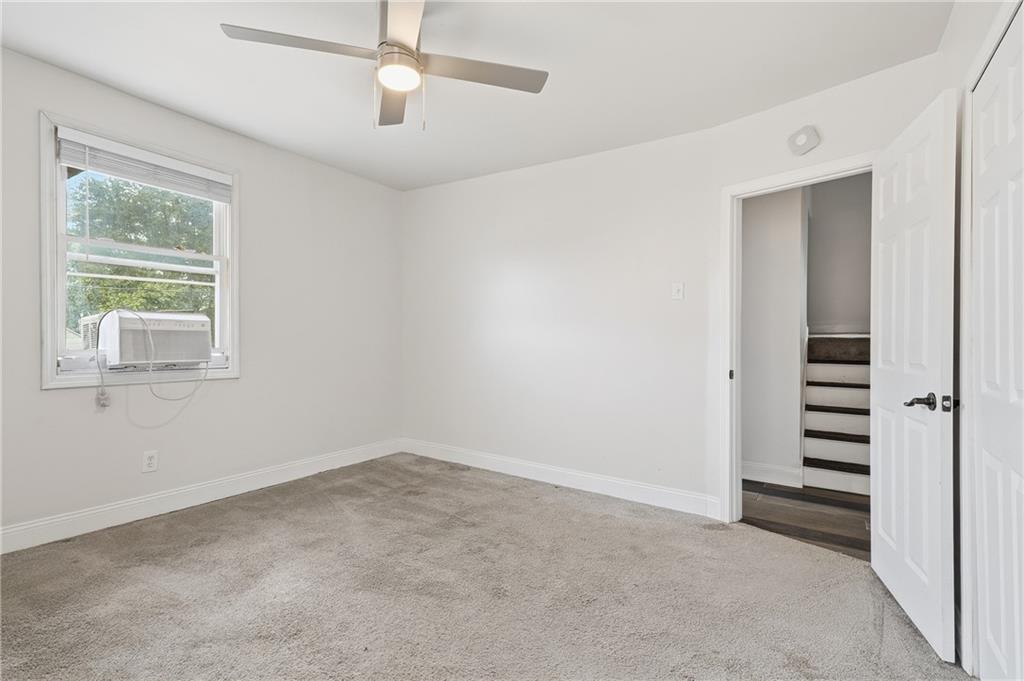 750 Mary Street McKees Rocks, PA 15136 - Photo 19 of 43 A second 13x13 bedroom with ceiling fan on the second floor.