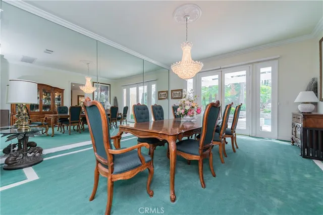 a kitchen with counter top space and living room