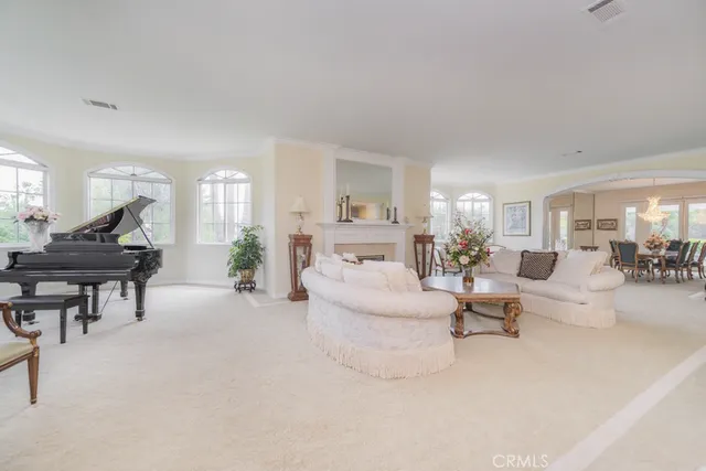 an aerial view of a house with a yard and garden