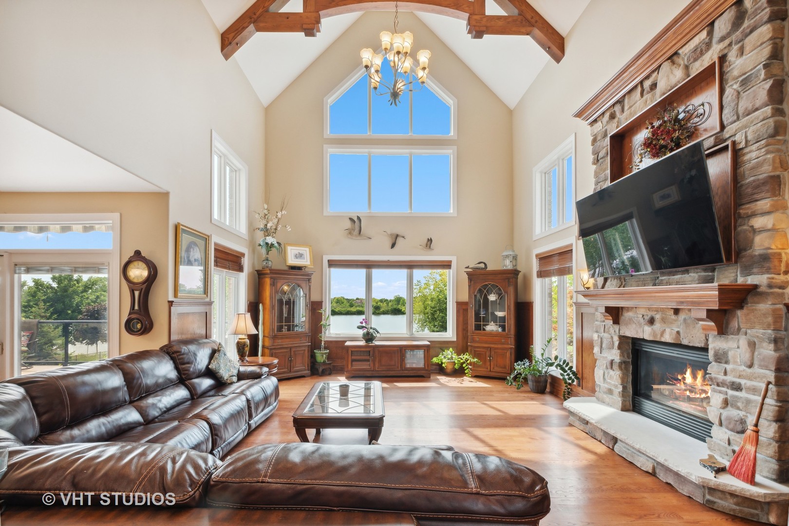 21170 Sage Brush Lane Mokena, IL 60448 - Photo 19 of 66 a living room with furniture a fireplace and a flat screen tv