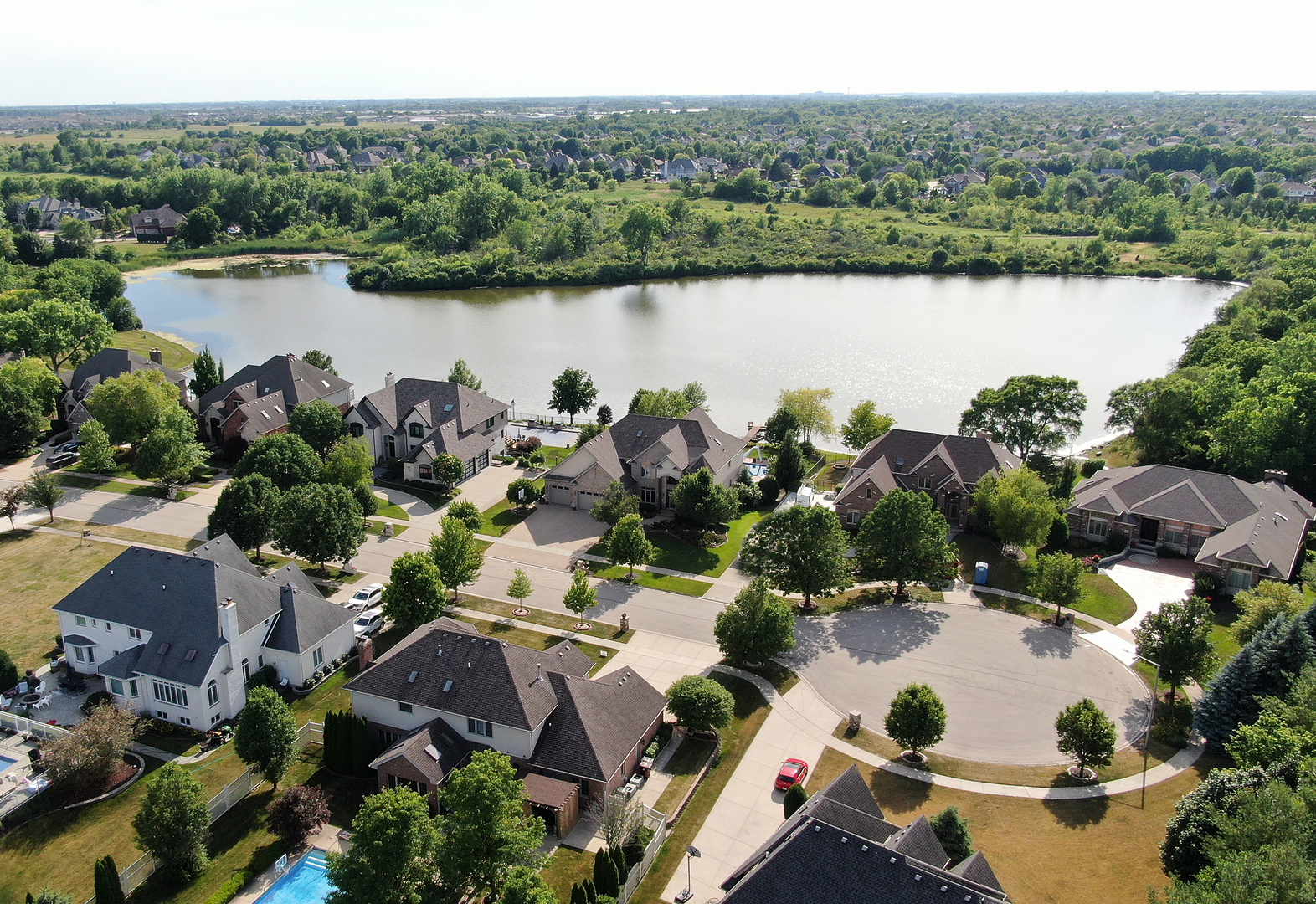 21170 Sage Brush Lane Mokena, IL 60448 - Photo 2 of 66 an aerial view of a house with a lake view