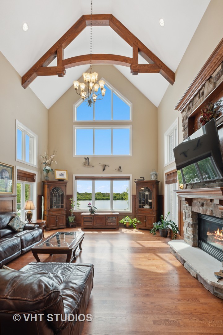 21170 Sage Brush Lane Mokena, IL 60448 - Photo 21 of 66 a living room with fireplace furniture and a flat screen tv