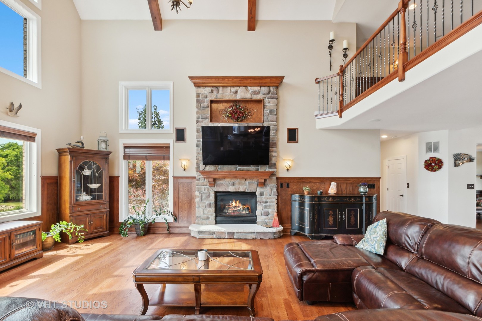 21170 Sage Brush Lane Mokena, IL 60448 - Photo 22 of 66 a living room with furniture a flat screen tv and a fireplace