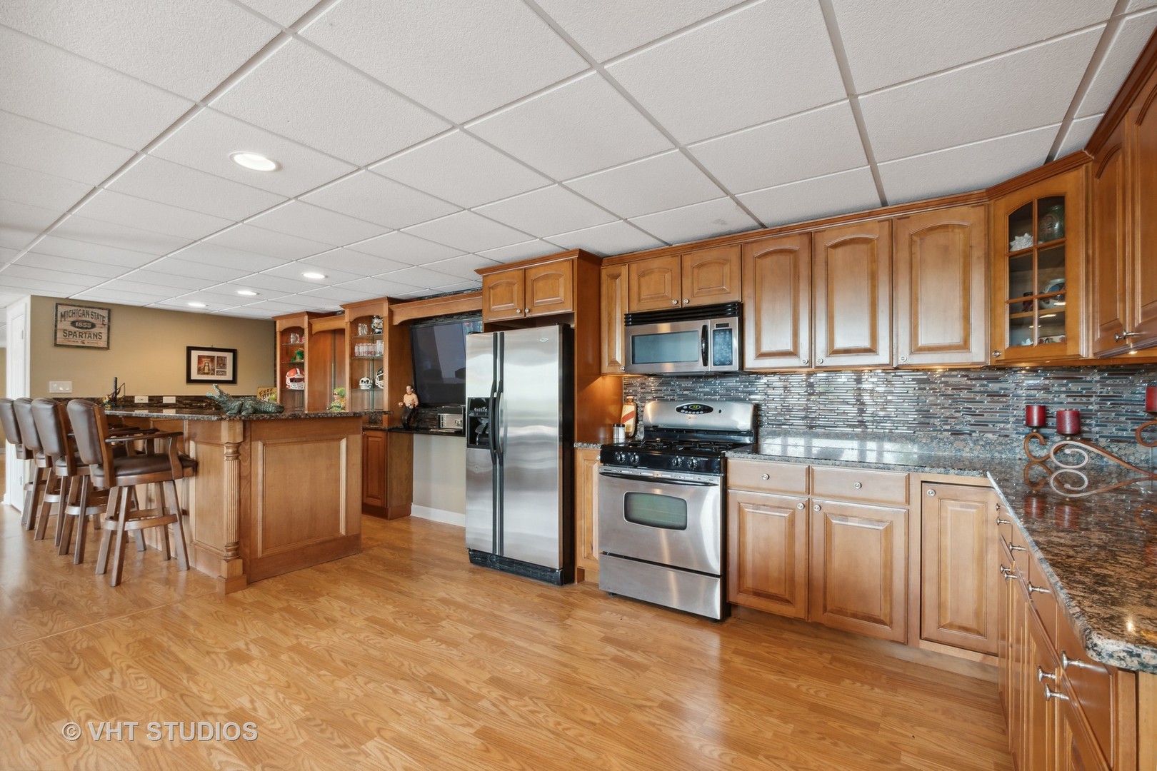 21170 Sage Brush Lane Mokena, IL 60448 - Photo 43 of 66 a kitchen with stainless steel appliances granite countertop a refrigerator and cabinets