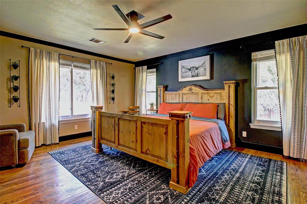 3615 Fritz Lane Corinth, TX 76208 - Photo 17 of 28 a bed room with a bed and a window