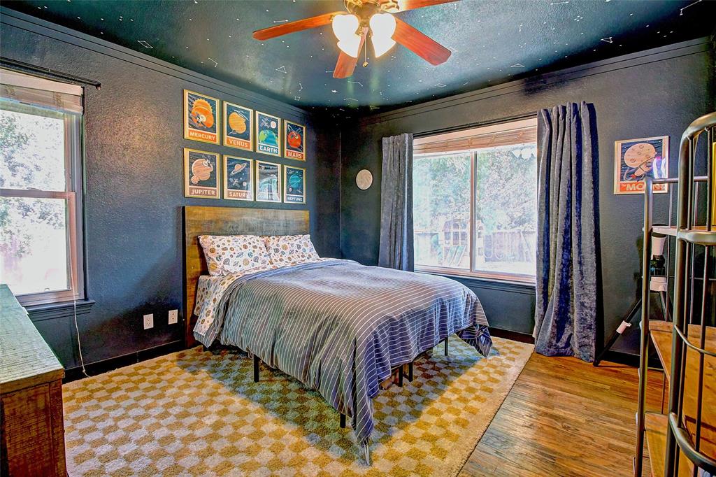 3615 Fritz Lane Corinth, TX 76208 - Photo 23 of 28 a bed sitting in a bedroom next to a window