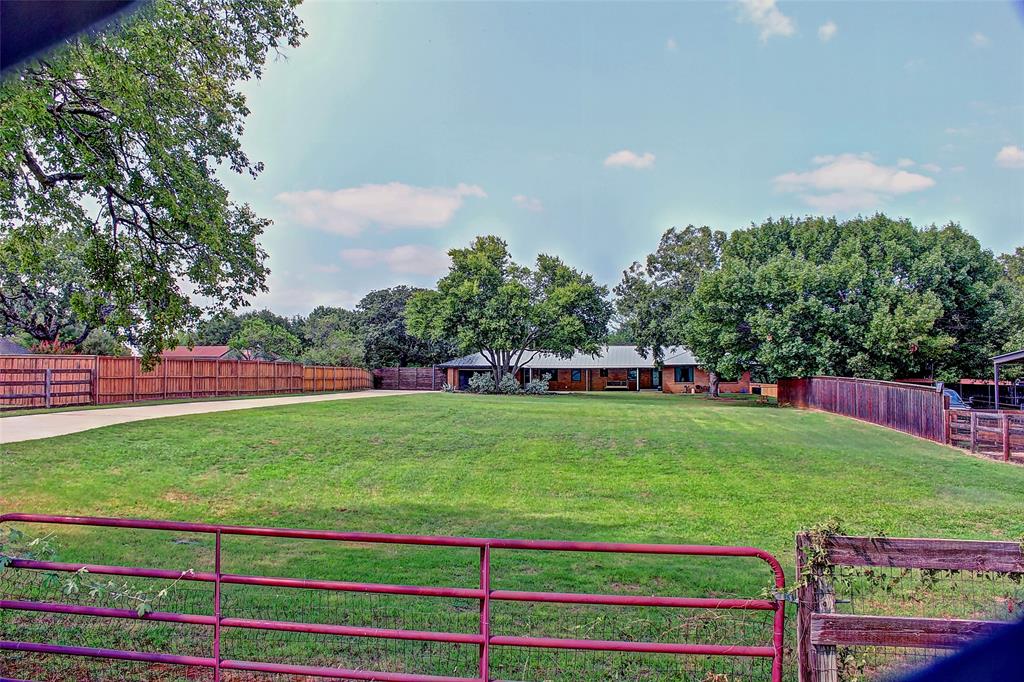 3615 Fritz Lane Corinth, TX 76208 - Photo 4 of 28 a green field with lots of trees in the background