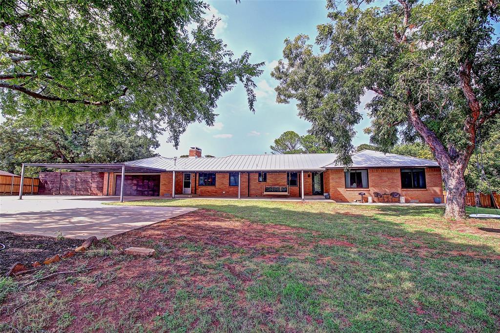 3615 Fritz Lane Corinth, TX 76208 - Photo 5 of 28 a front view of a house with a garden