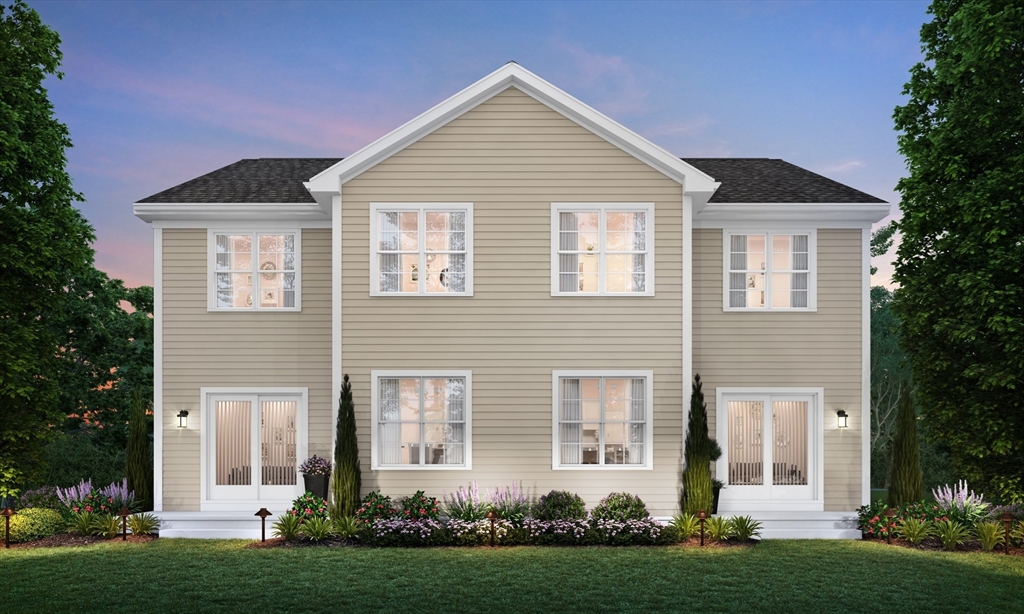 5 Eagle Brook Boulevard, Unit 125 Wrentham, MA 02093 - Photo 2 of 9 a front view of a house with a yard and garage