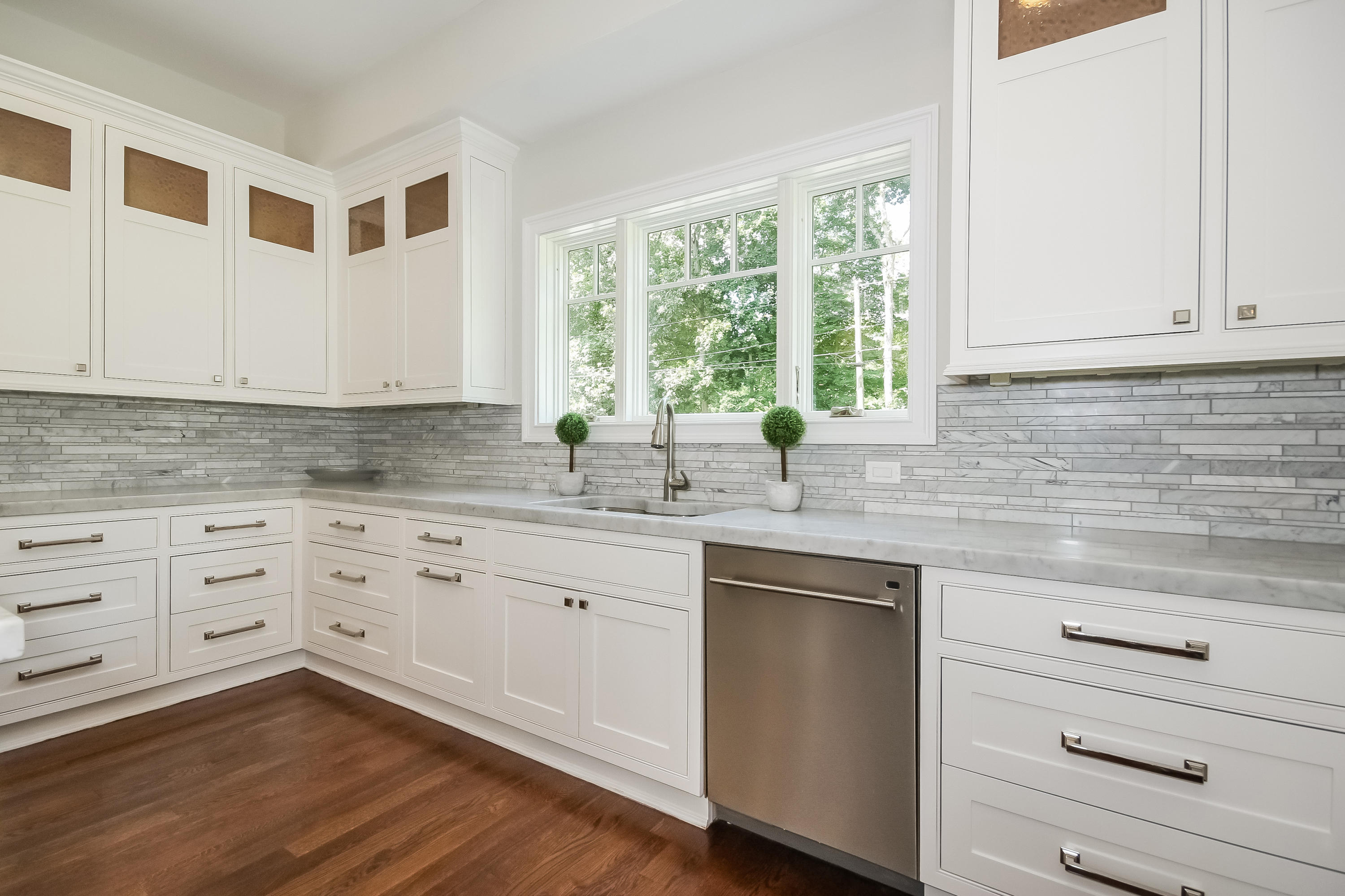 100 Leeuwarden Road Darien, CT 06820 - Photo 16 of 70 a kitchen with granite countertop white cabinets and white appliances