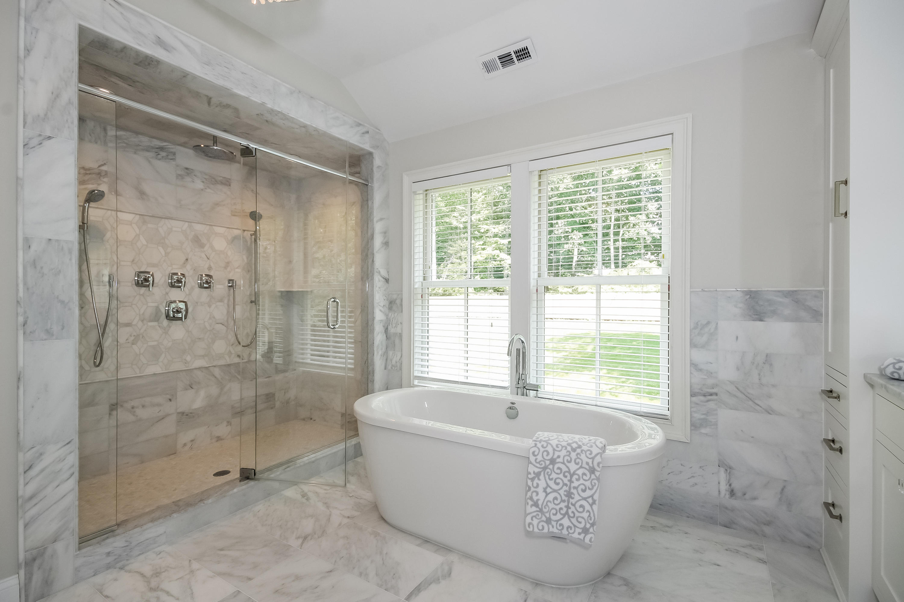 100 Leeuwarden Road Darien, CT 06820 - Photo 38 of 70 a bathroom with a tub shower and window