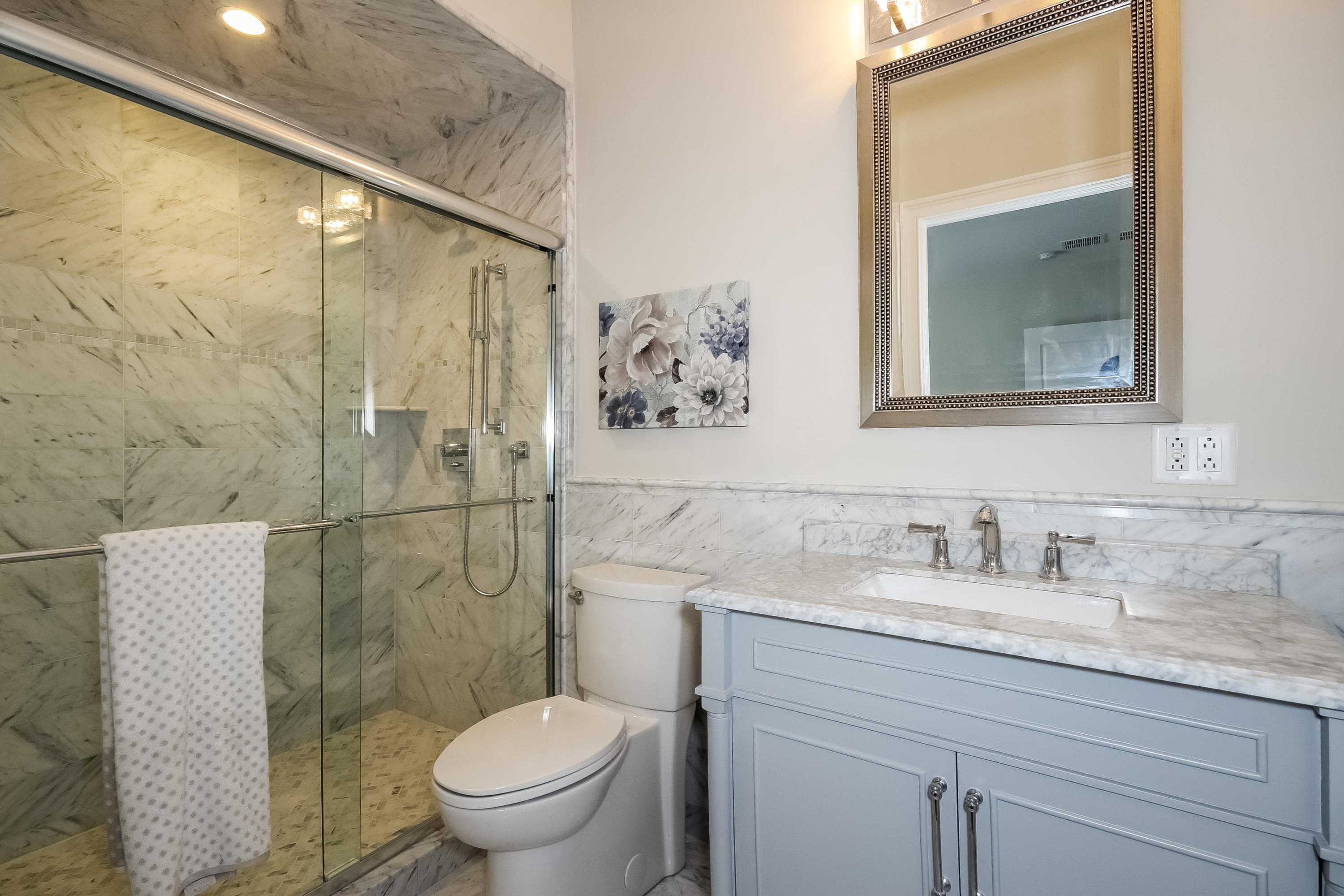 100 Leeuwarden Road Darien, CT 06820 - Photo 47 of 70 a bathroom with a granite countertop toilet sink and mirror