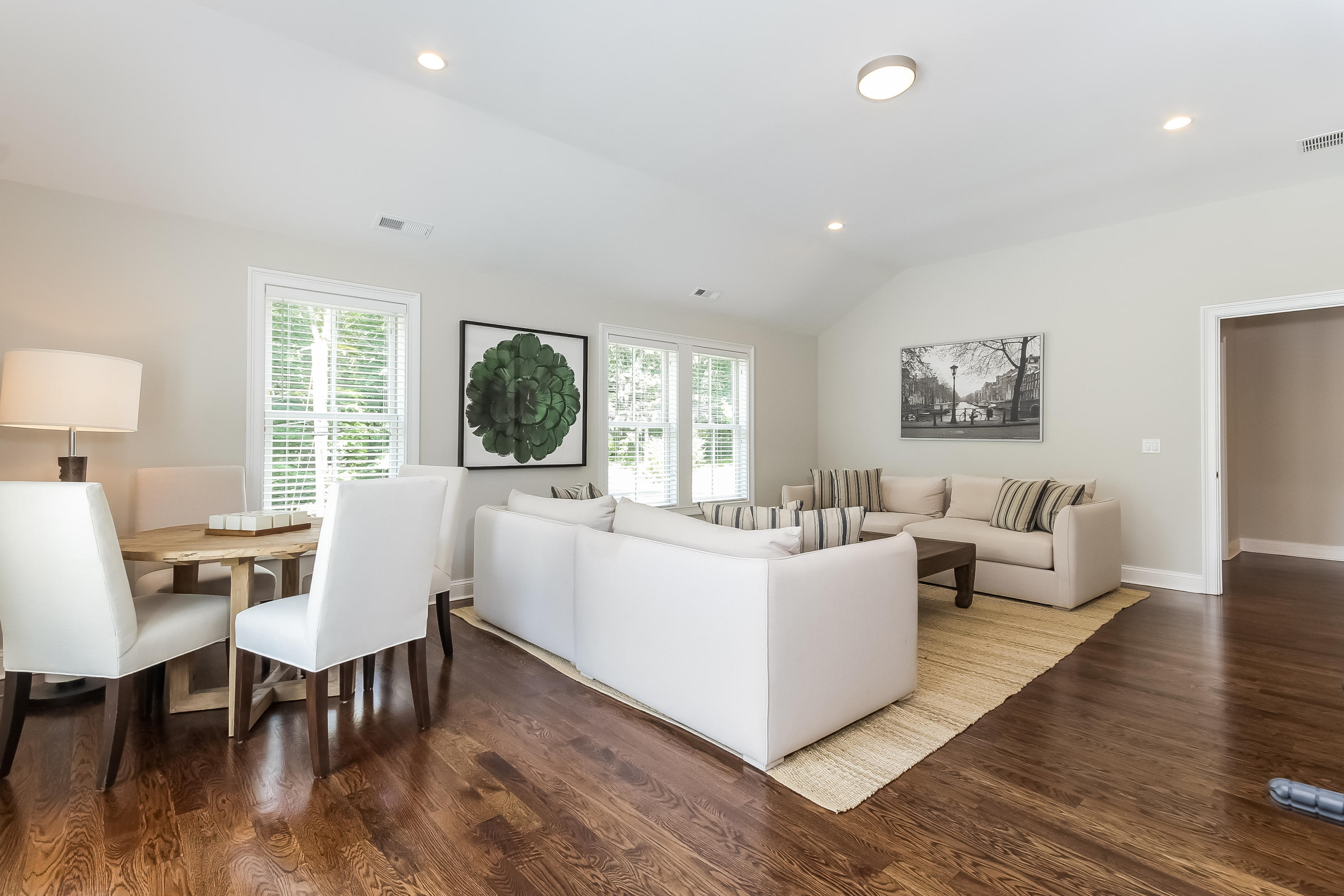 100 Leeuwarden Road Darien, CT 06820 - Photo 54 of 70 a living room with furniture a dining table and a large window