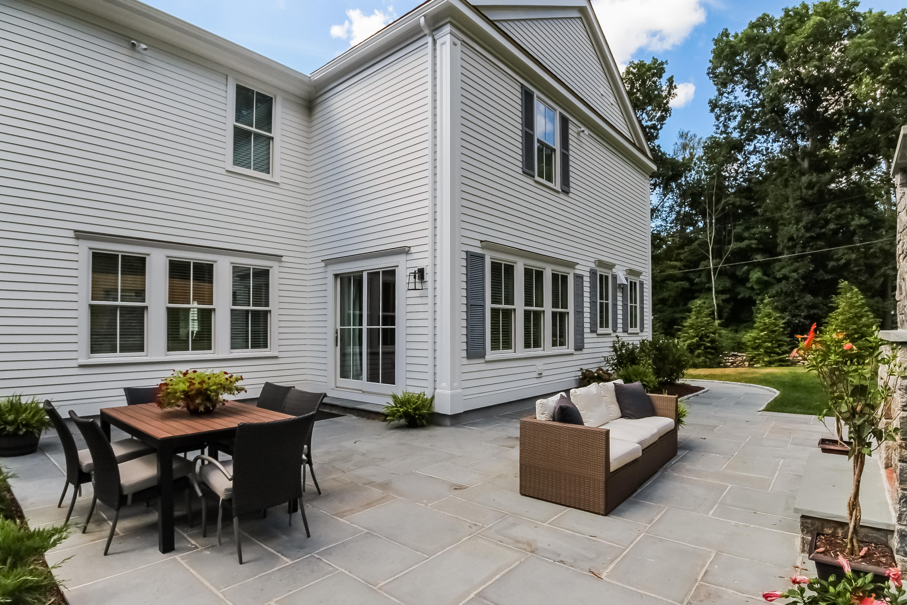 100 Leeuwarden Road Darien, CT 06820 - Photo 60 of 70 a view of a house with a backyard and sitting area
