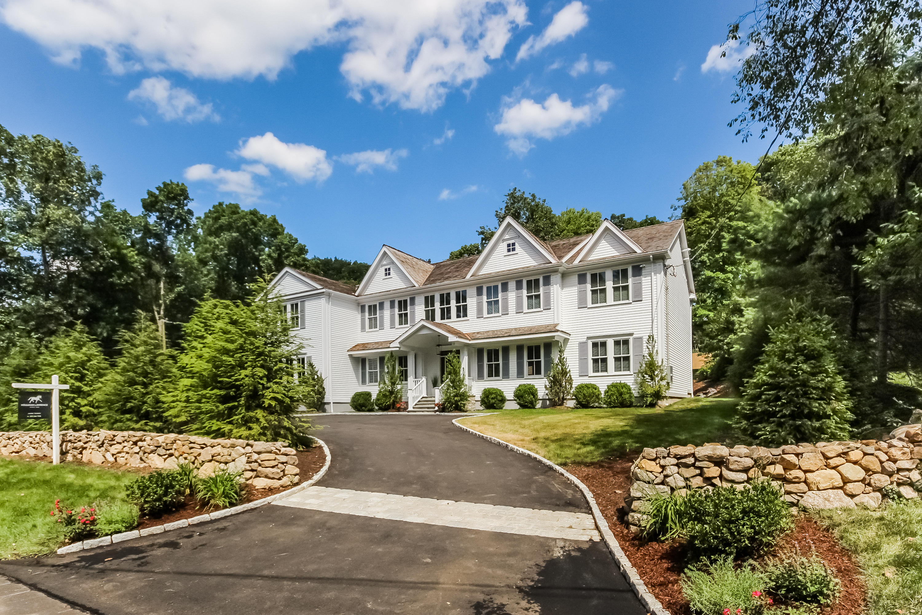 100 Leeuwarden Road Darien, CT 06820 - Photo 66 of 70 a front view of a house with a garden