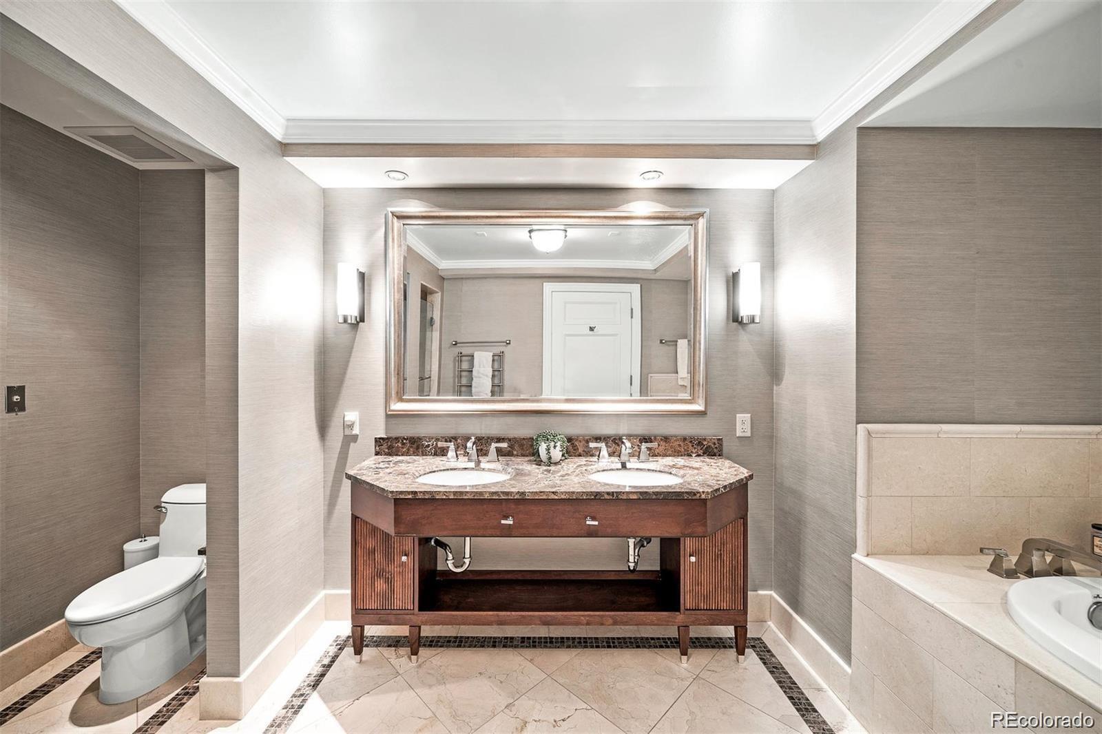 1891 Curtis Street, Unit 1607 Denver, CO 80202 - Photo 19 of 47 a bathroom with a sink and a mirror