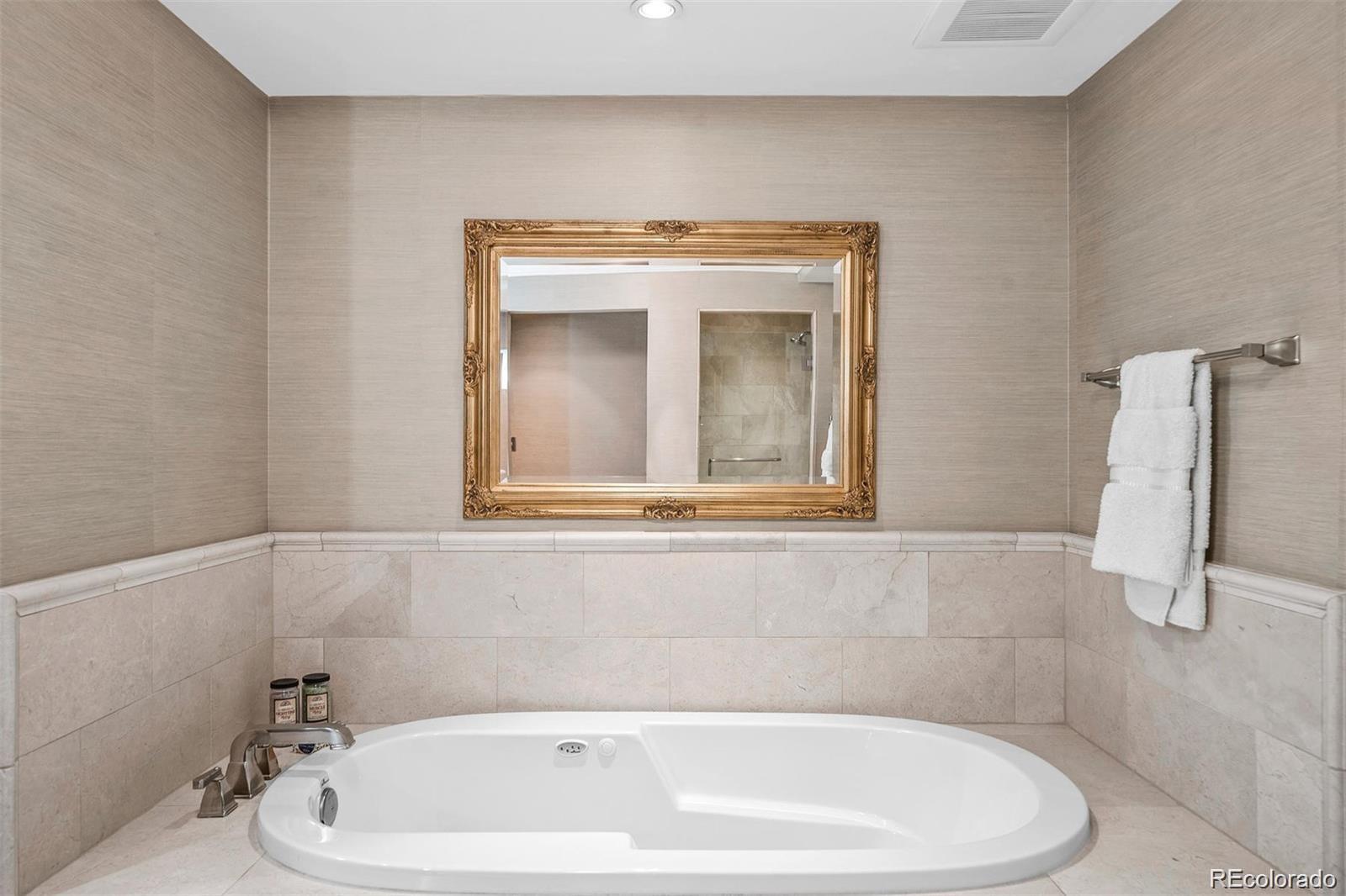 1891 Curtis Street, Unit 1607 Denver, CO 80202 - Photo 20 of 47 a bathroom with a white tub