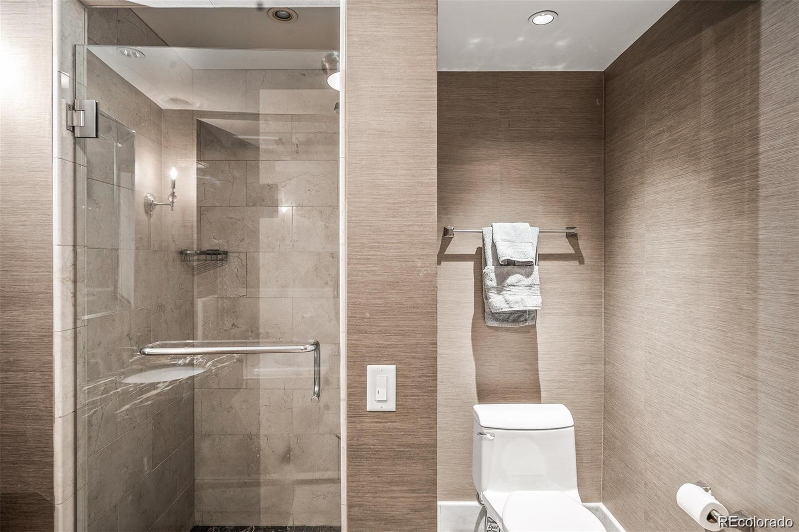 1891 Curtis Street, Unit 1607 Denver, CO 80202 - Photo 29 of 47 a bathroom with a toilet and a shower