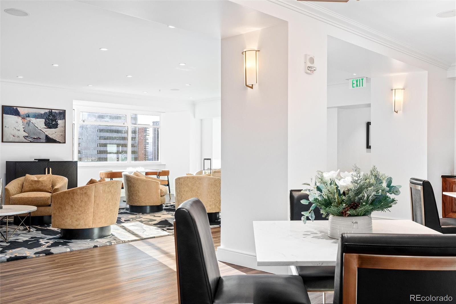 1891 Curtis Street, Unit 1607 Denver, CO 80202 - Photo 36 of 47 a living room with furniture fireplace and a large window