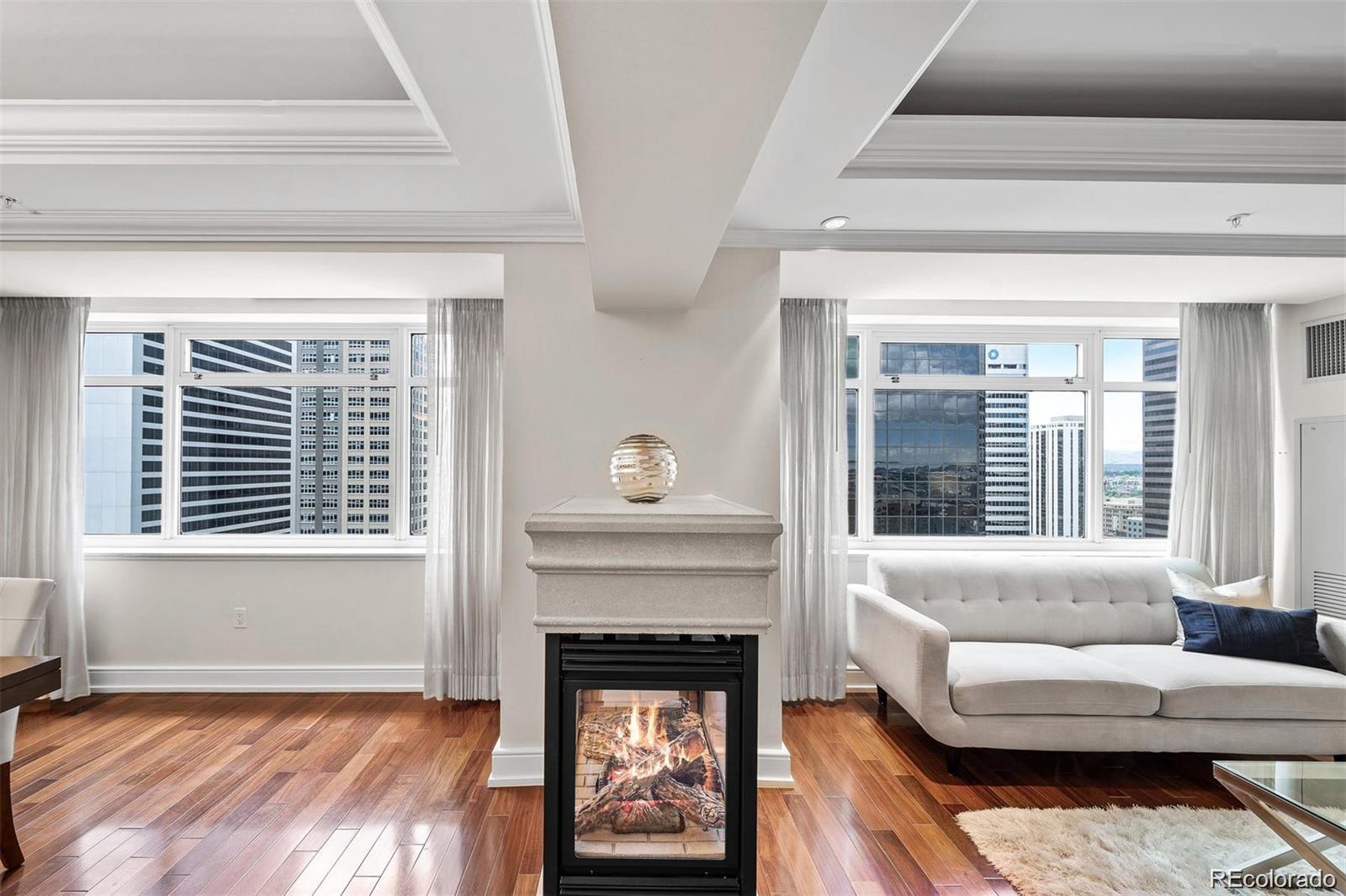 1891 Curtis Street, Unit 1607 Denver, CO 80202 - Photo 10 of 47 a living room with furniture and a fireplace