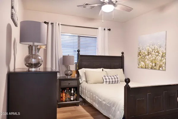 a bedroom with bed and window