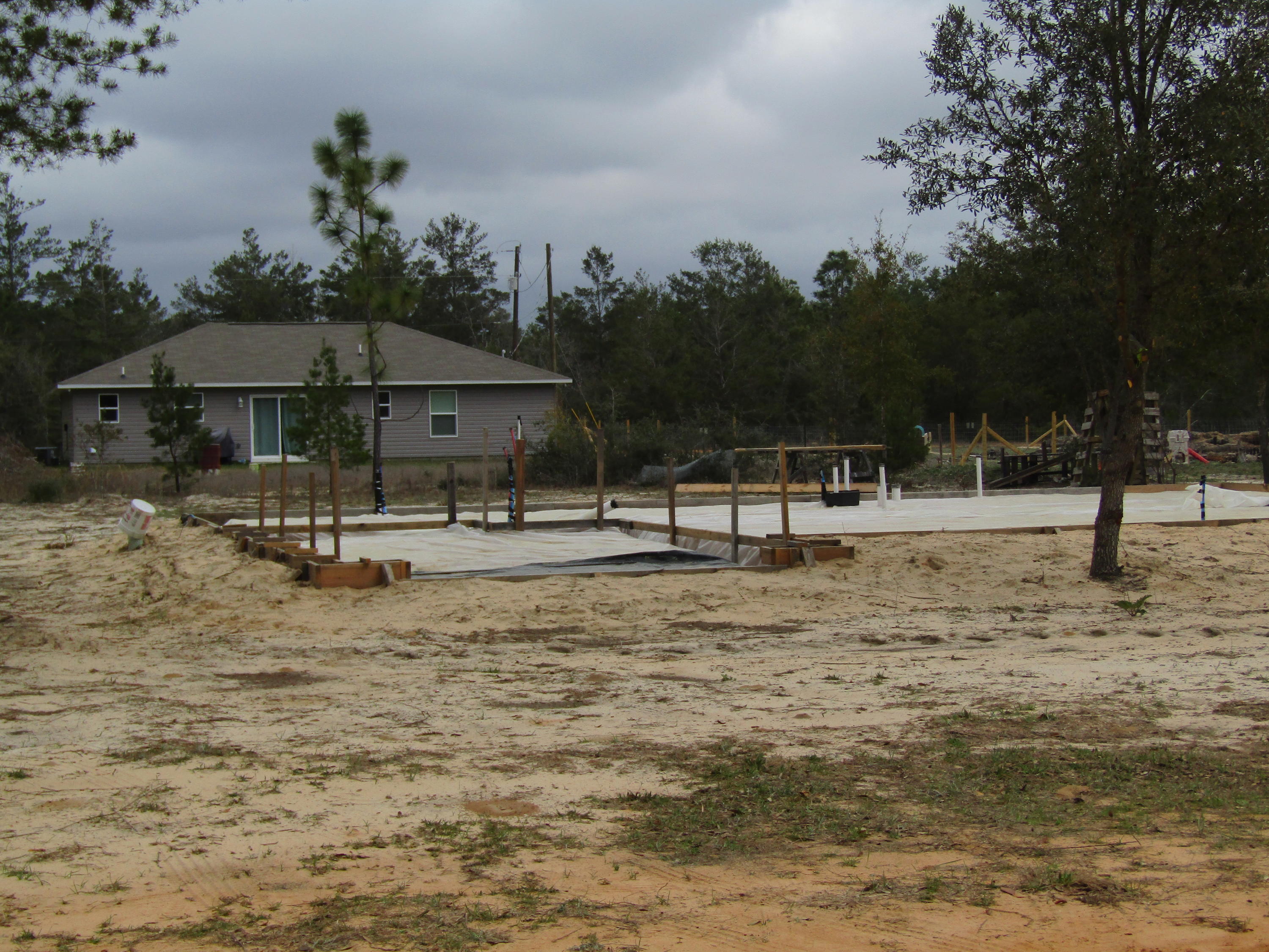 331 Passion Flower Street DeFuniak Springs, FL 32433 - Photo 1 of 5 a view of a town with trees and houses