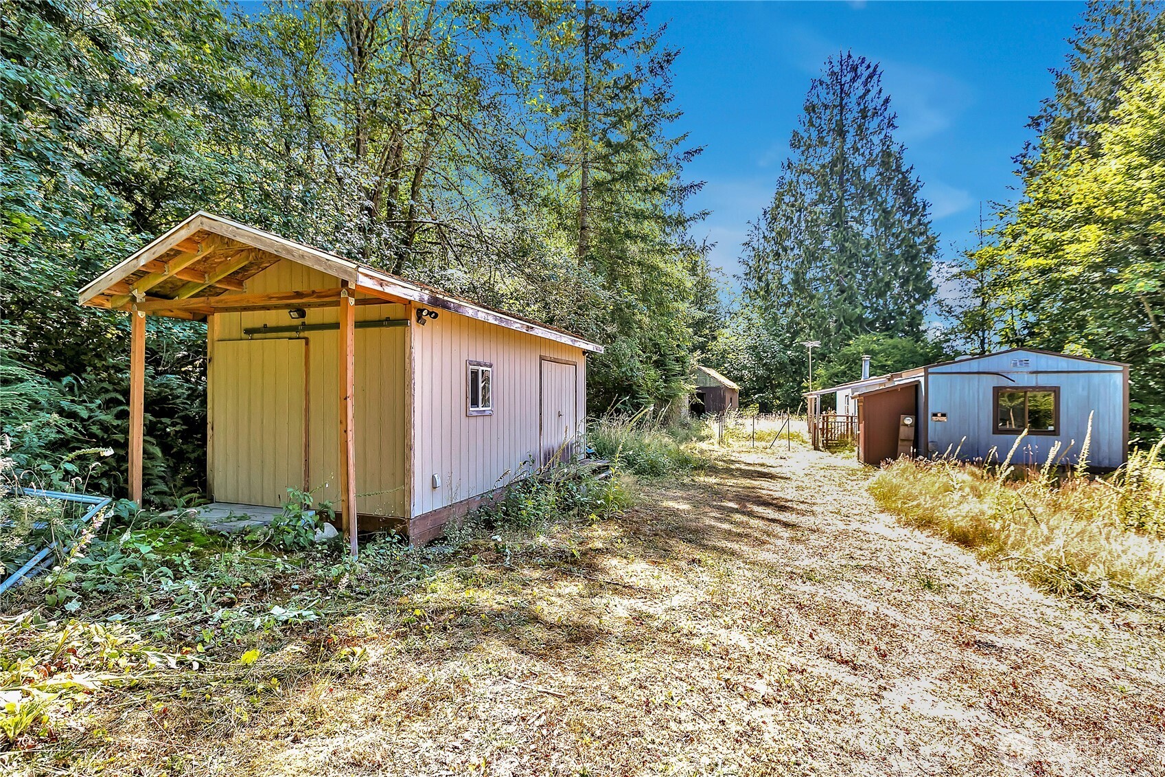 28215 Southeast 216th Street Maple Valley, WA 98038 - Photo 8 of 21 a front view of a house with garden