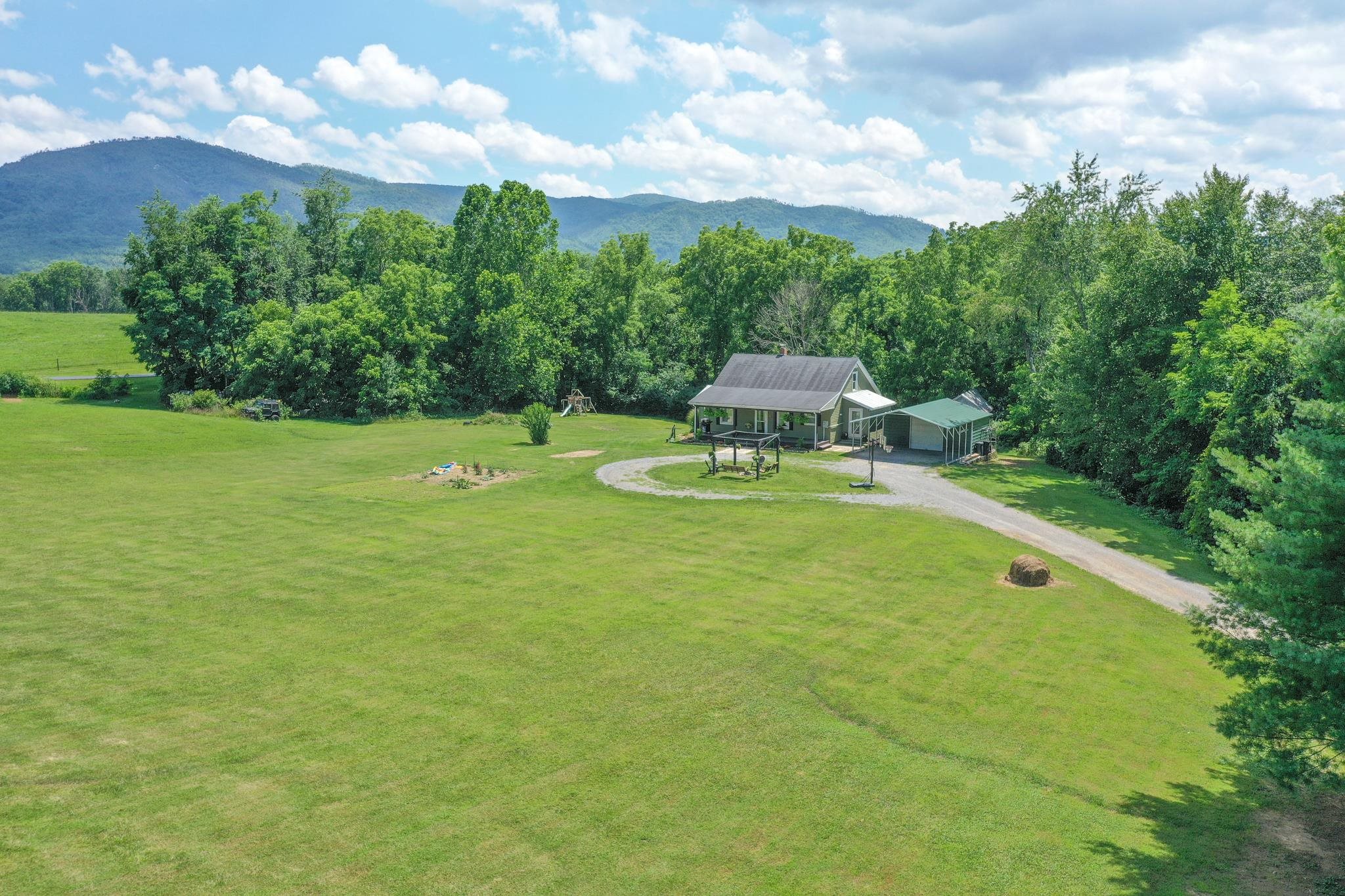 555 Dabneys Road Raphine, VA 24472 - Photo 7 of 30 a swimming pool with trees in the background