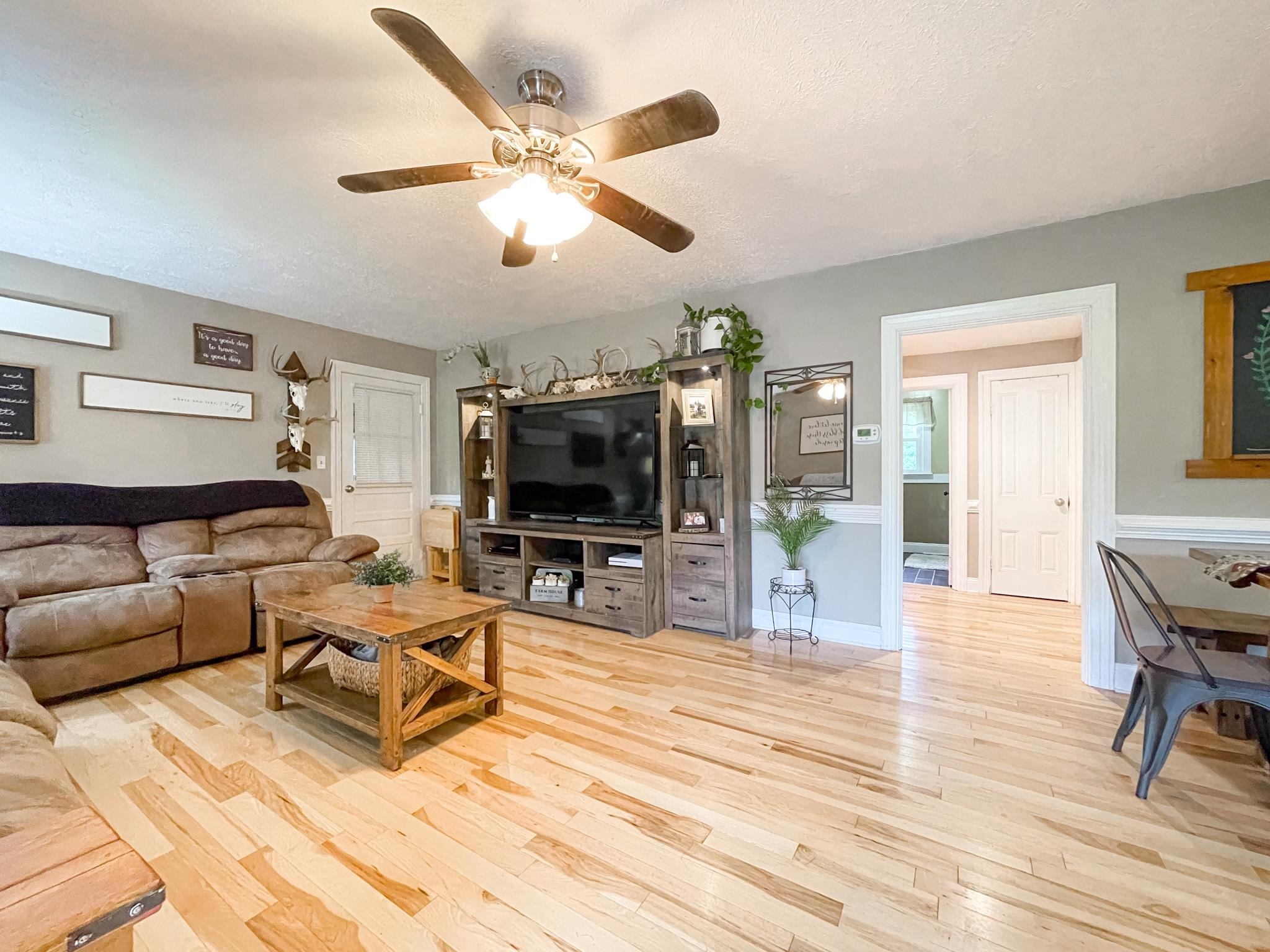 555 Dabneys Road Raphine, VA 24472 - Photo 8 of 30 a living room with furniture and a flat screen tv