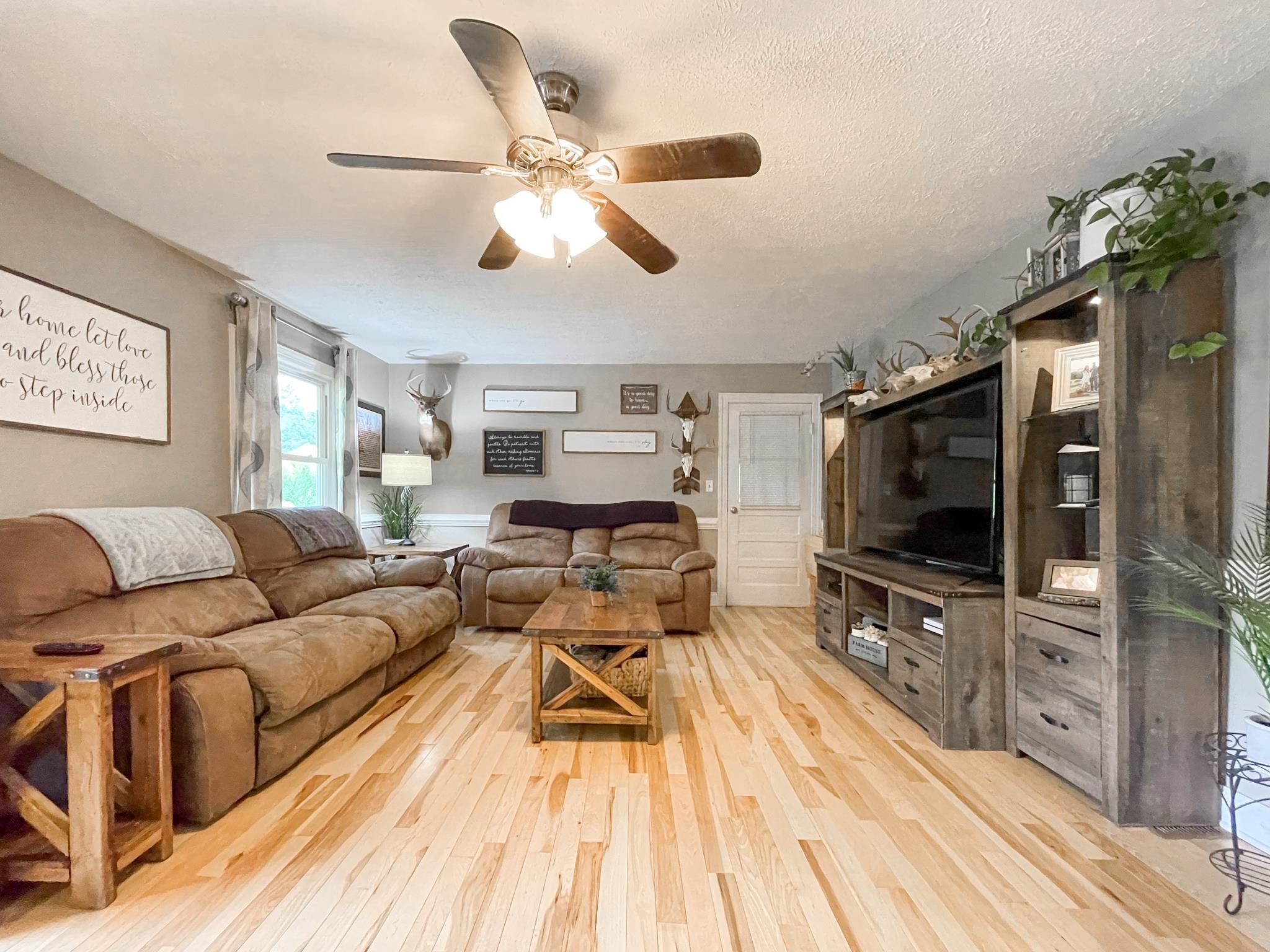 555 Dabneys Road Raphine, VA 24472 - Photo 9 of 30 a living room with furniture and a flat screen tv