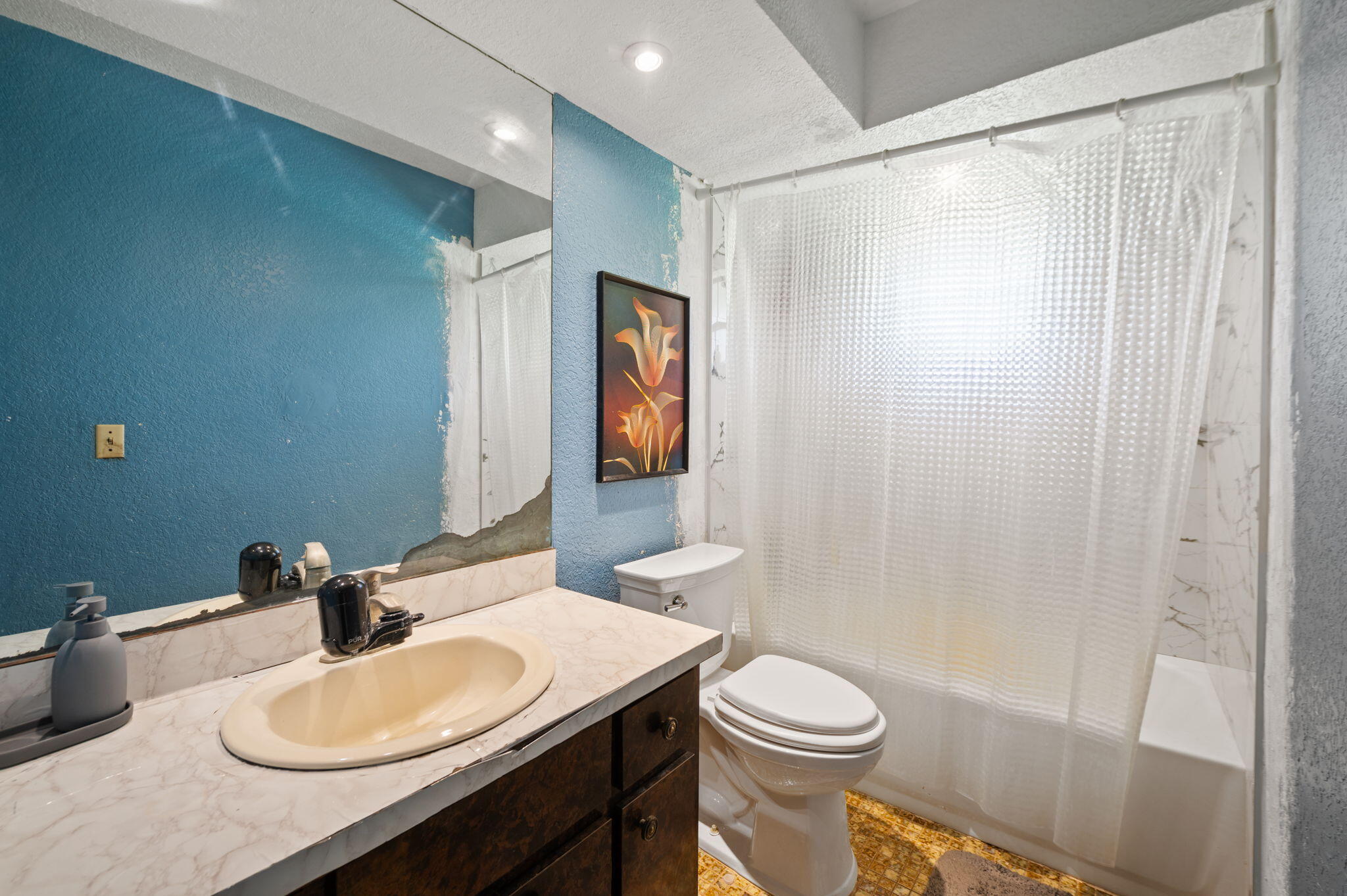 2587 E Road Loxahatchee Groves, FL 33470 - Photo 15 of 46 a bathroom with a sink a toilet and shower