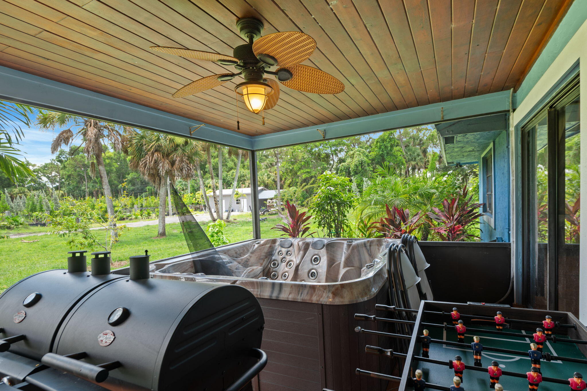2587 E Road Loxahatchee Groves, FL 33470 - Photo 24 of 46 a view of a dining room with furniture window and outside view