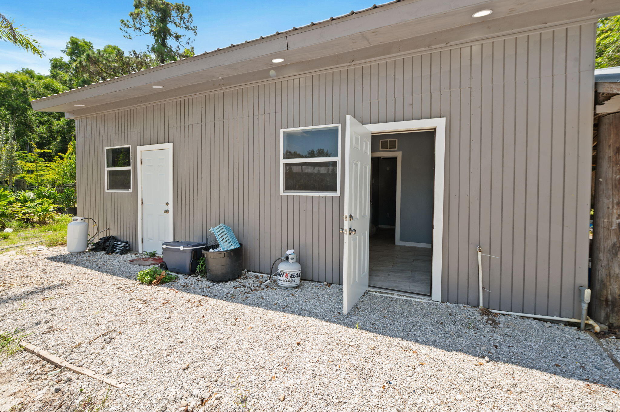 2587 E Road Loxahatchee Groves, FL 33470 - Photo 27 of 46 a backyard of a house