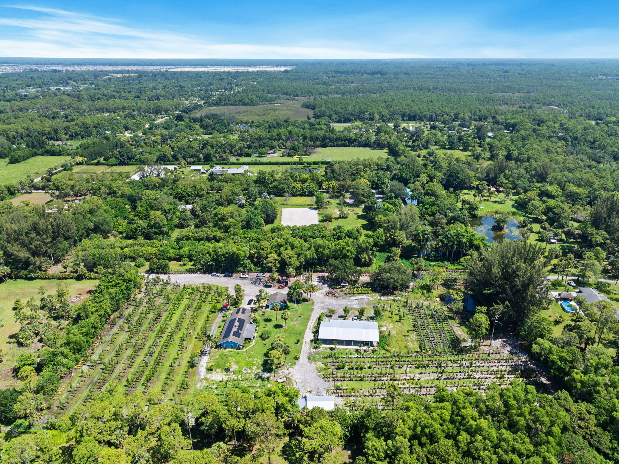 2587 E Road Loxahatchee Groves, FL 33470 - Photo 39 of 46 an aerial view of a house with a yard