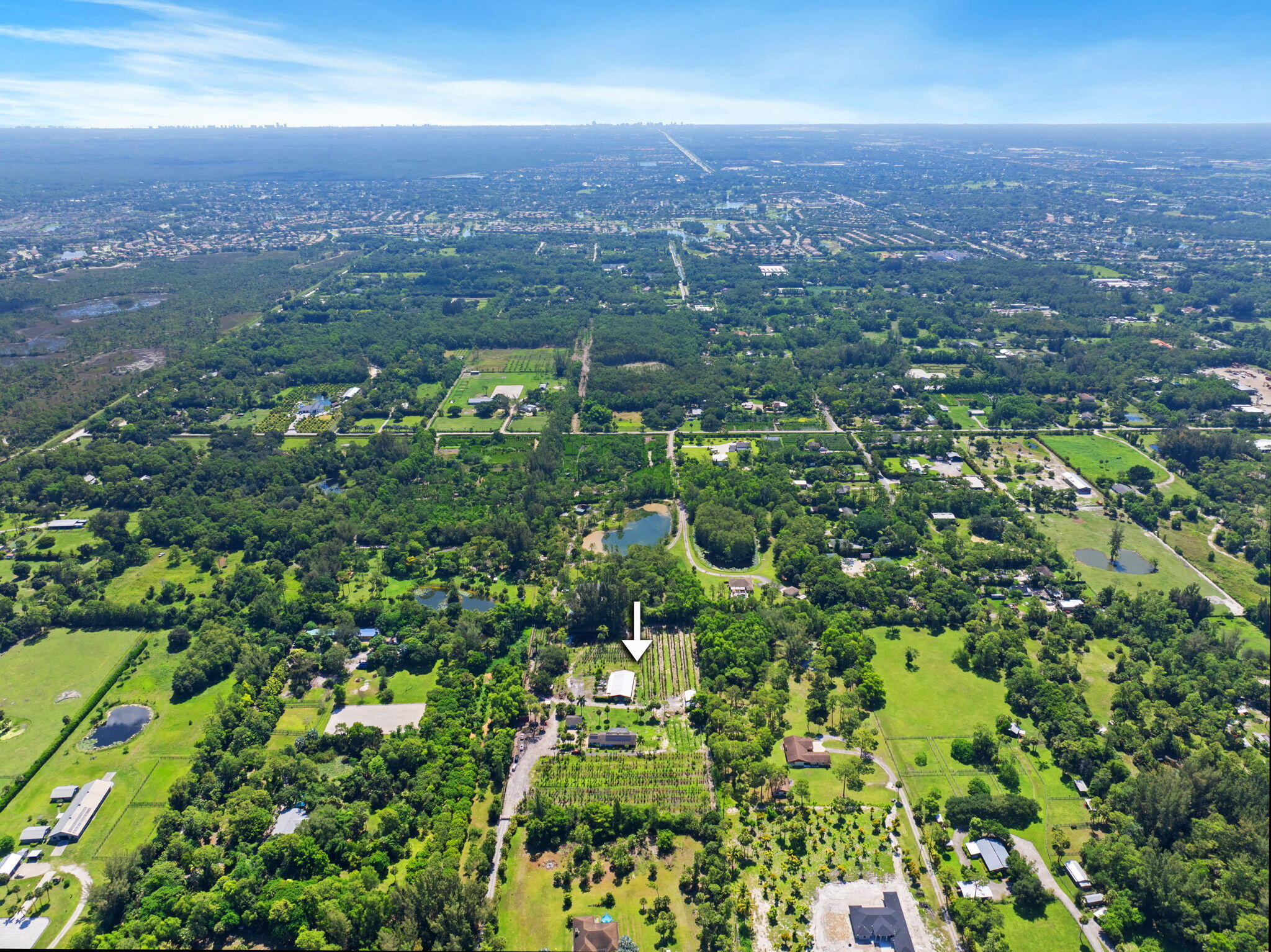 2587 E Road Loxahatchee Groves, FL 33470 - Photo 40 of 46 an aerial view of residential houses with city view and lake view