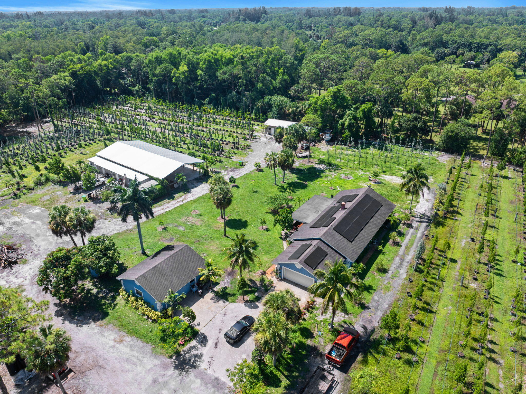 2587 E Road Loxahatchee Groves, FL 33470 - Photo 44 of 46 an aerial view of a house with a yard