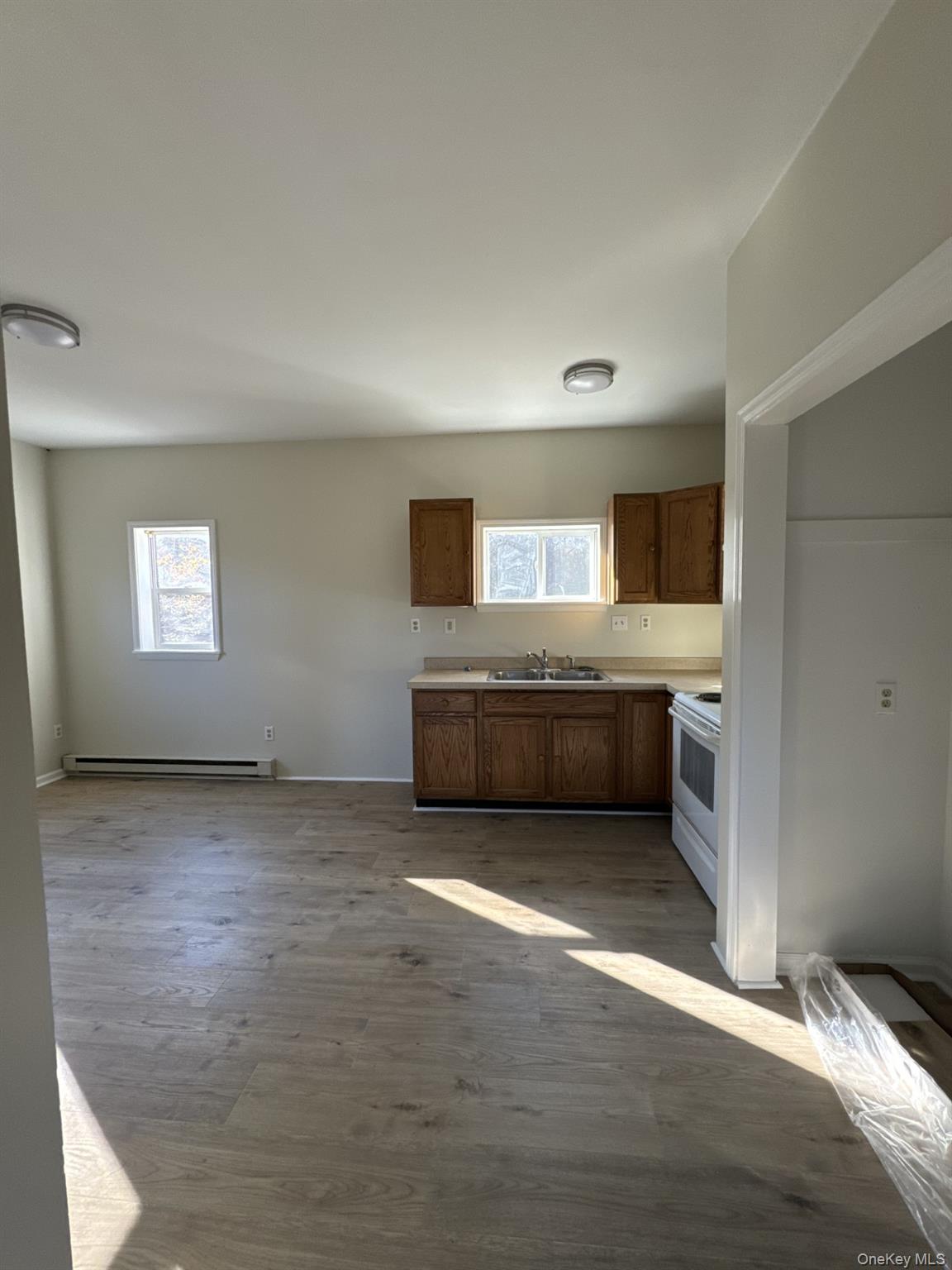 400 Round Lake Road, Unit A Rhinebeck, NY 12572 - Photo 4 of 11 a view of a big room with wooden floor and windows