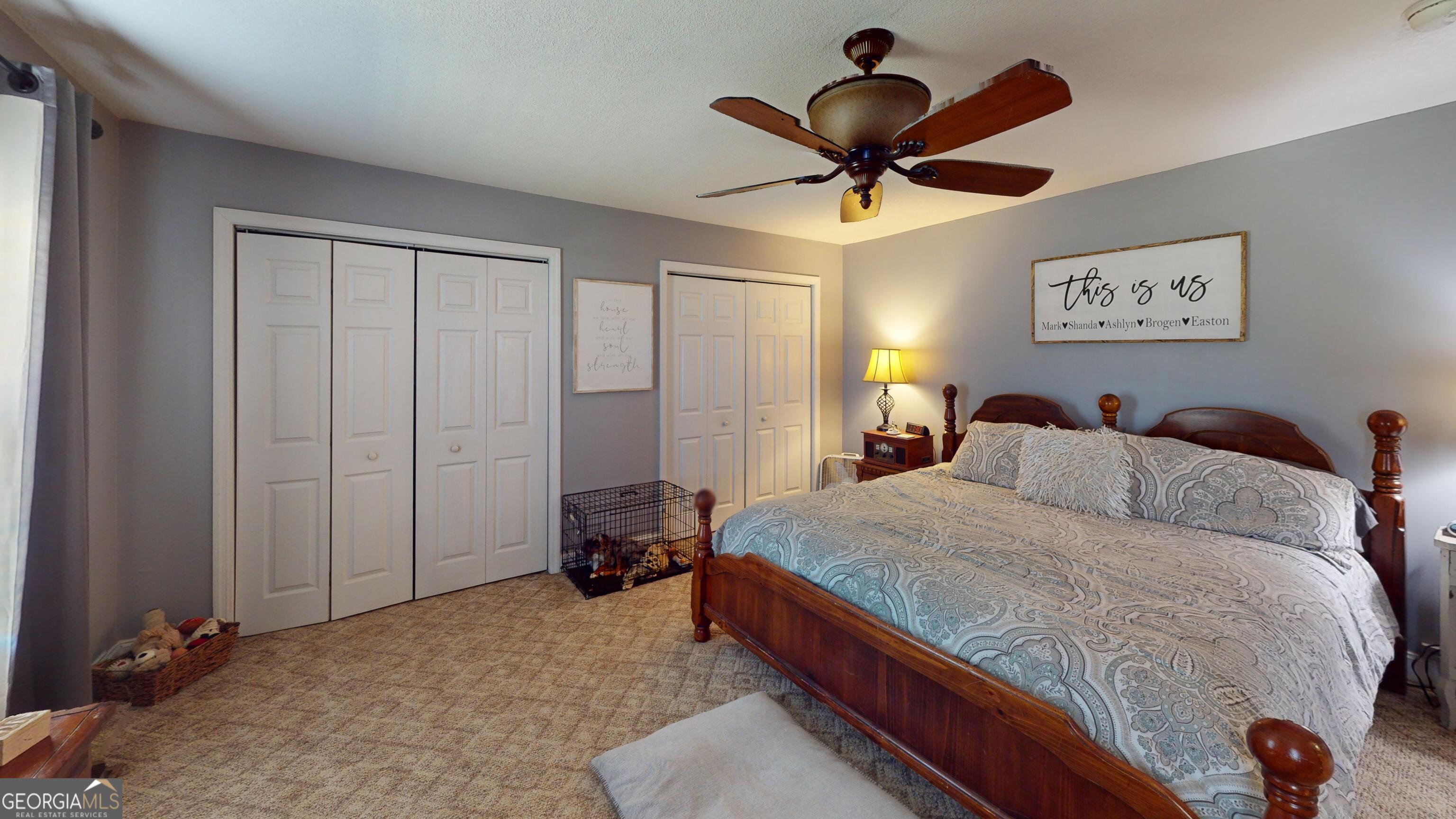 184 Eagle Pass Swainsboro, GA 30401 - Photo 27 of 49 a bed room with a bed and a ceiling fan