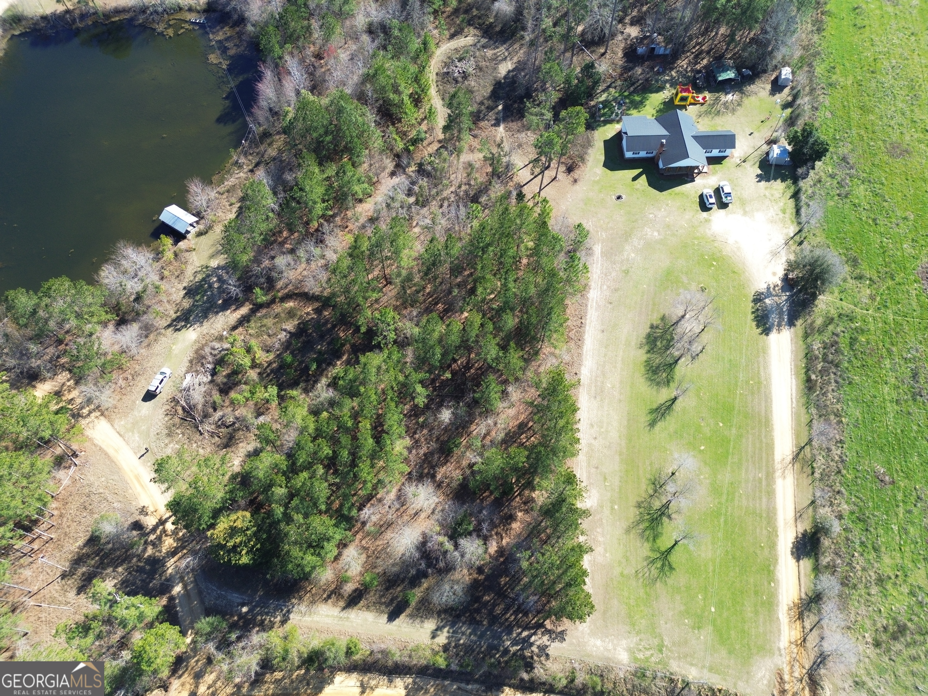184 Eagle Pass Swainsboro, GA 30401 - Photo 42 of 49 a view of a house with a yard and garden