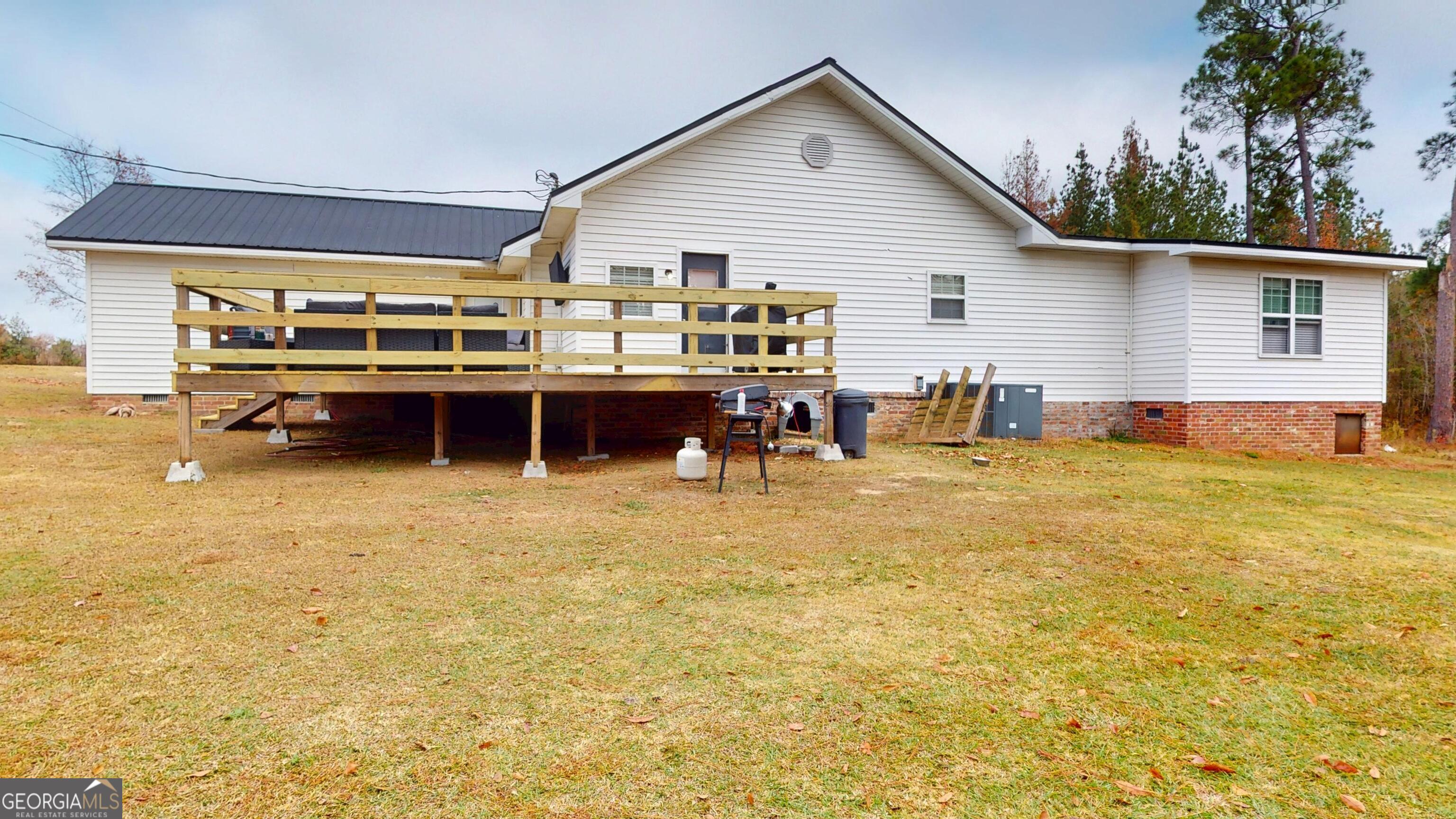184 Eagle Pass Swainsboro, GA 30401 - Photo 48 of 49 a view of swimming pool with outdoor seating and yard
