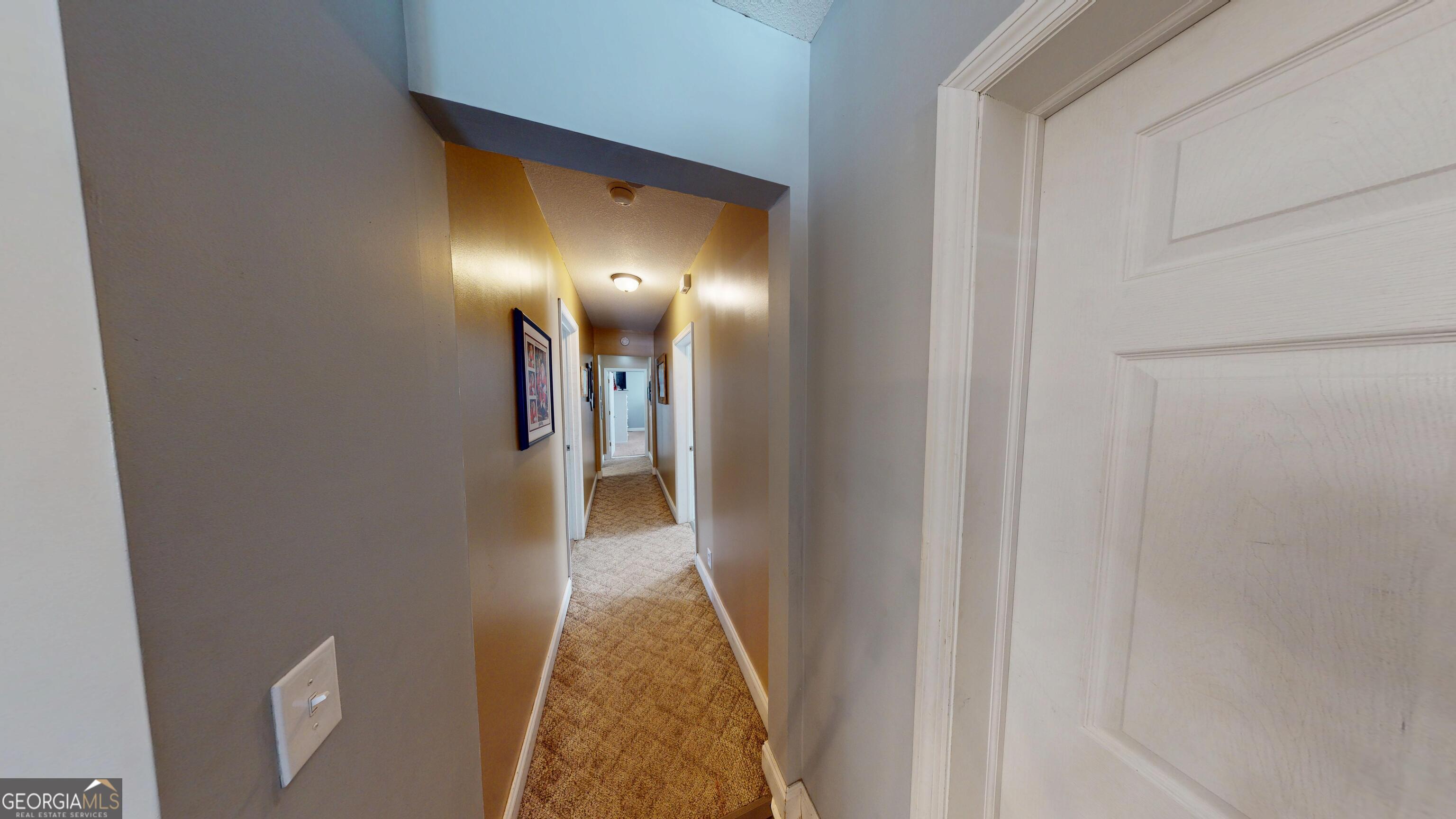 184 Eagle Pass Swainsboro, GA 30401 - Photo 9 of 49 a view of a hallway with a room