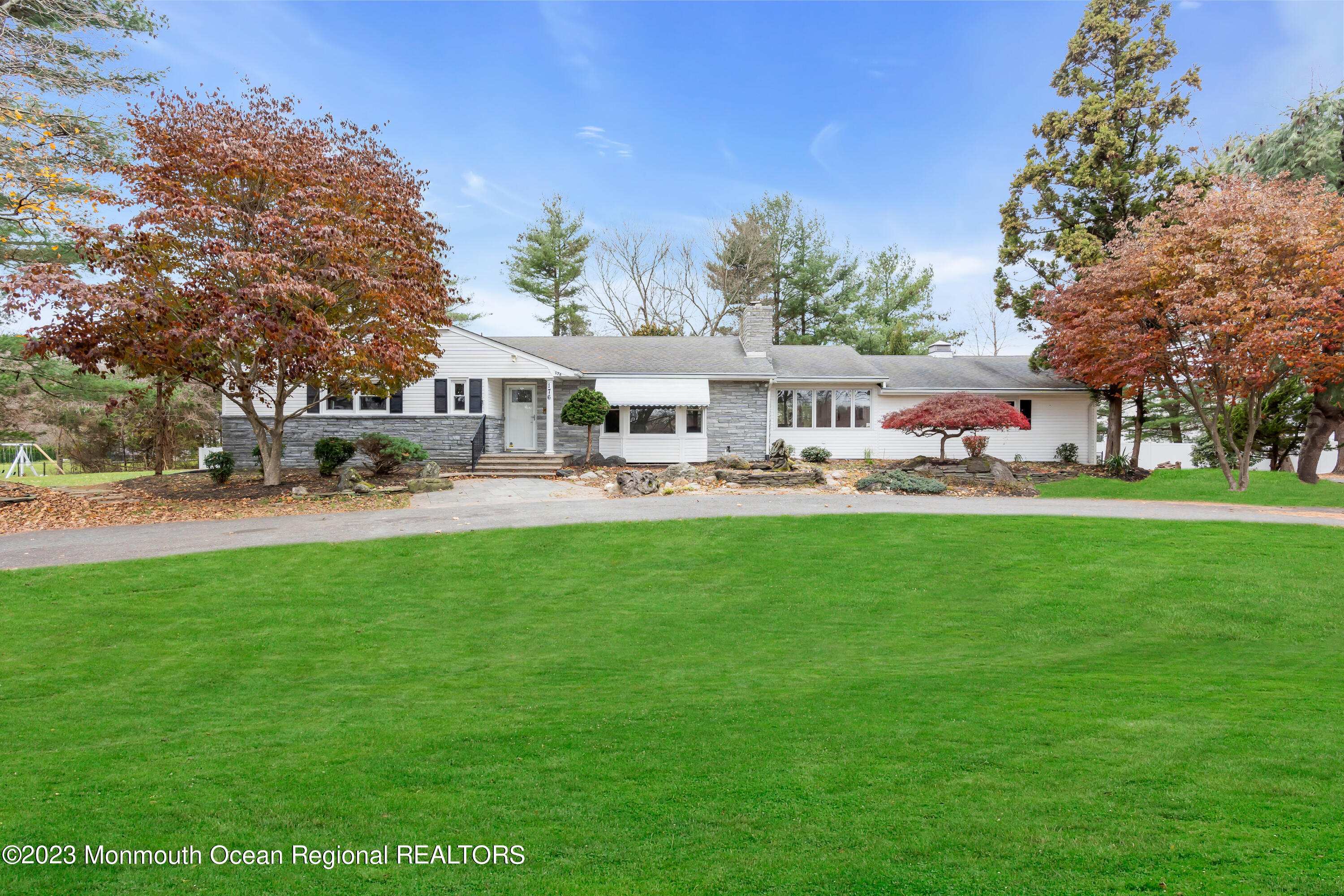 176 Bartley Road Jackson, NJ 08527 - Photo 13 of 51 a front view of a building with garden and trees
