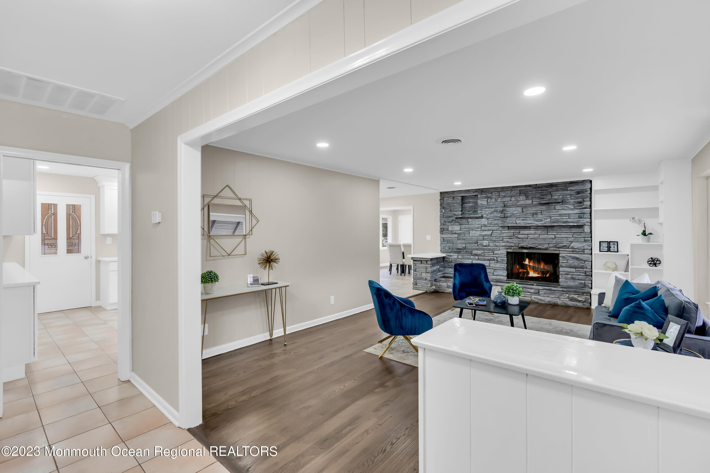 176 Bartley Road Jackson, NJ 08527 - Photo 17 of 51 a living room with furniture a fireplace and a table
