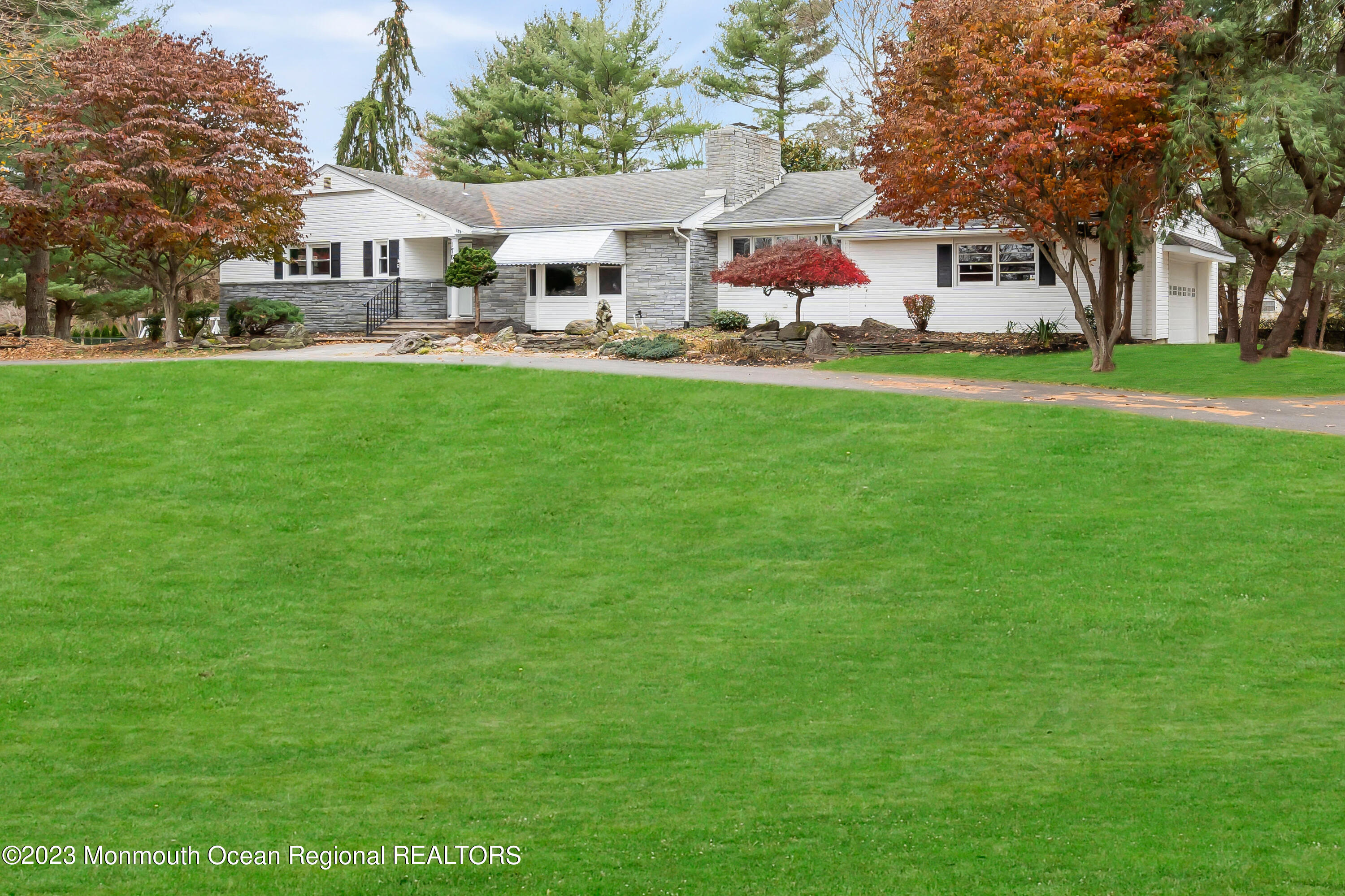 176 Bartley Road Jackson, NJ 08527 - Photo 2 of 51 a front view of a house with a yard and trees